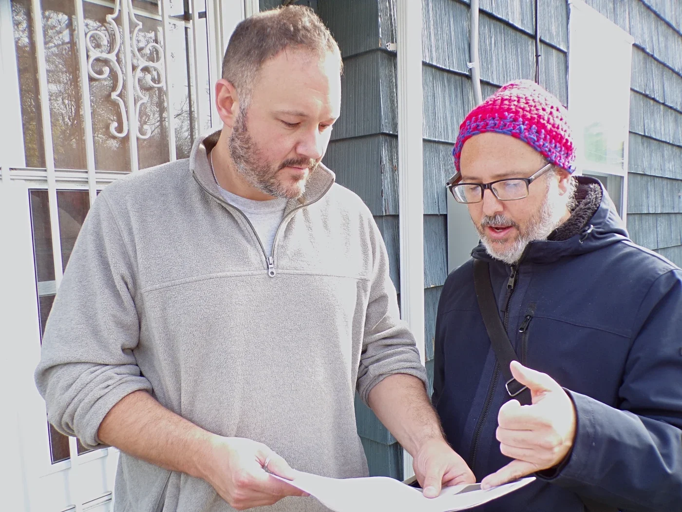 A volunteer talking to a man about membership