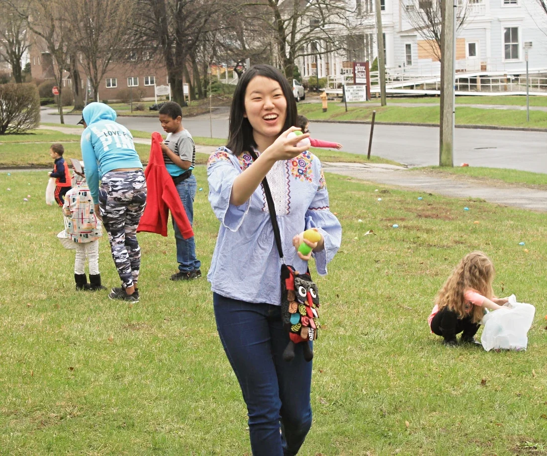 Young woman holding up Easter eggs