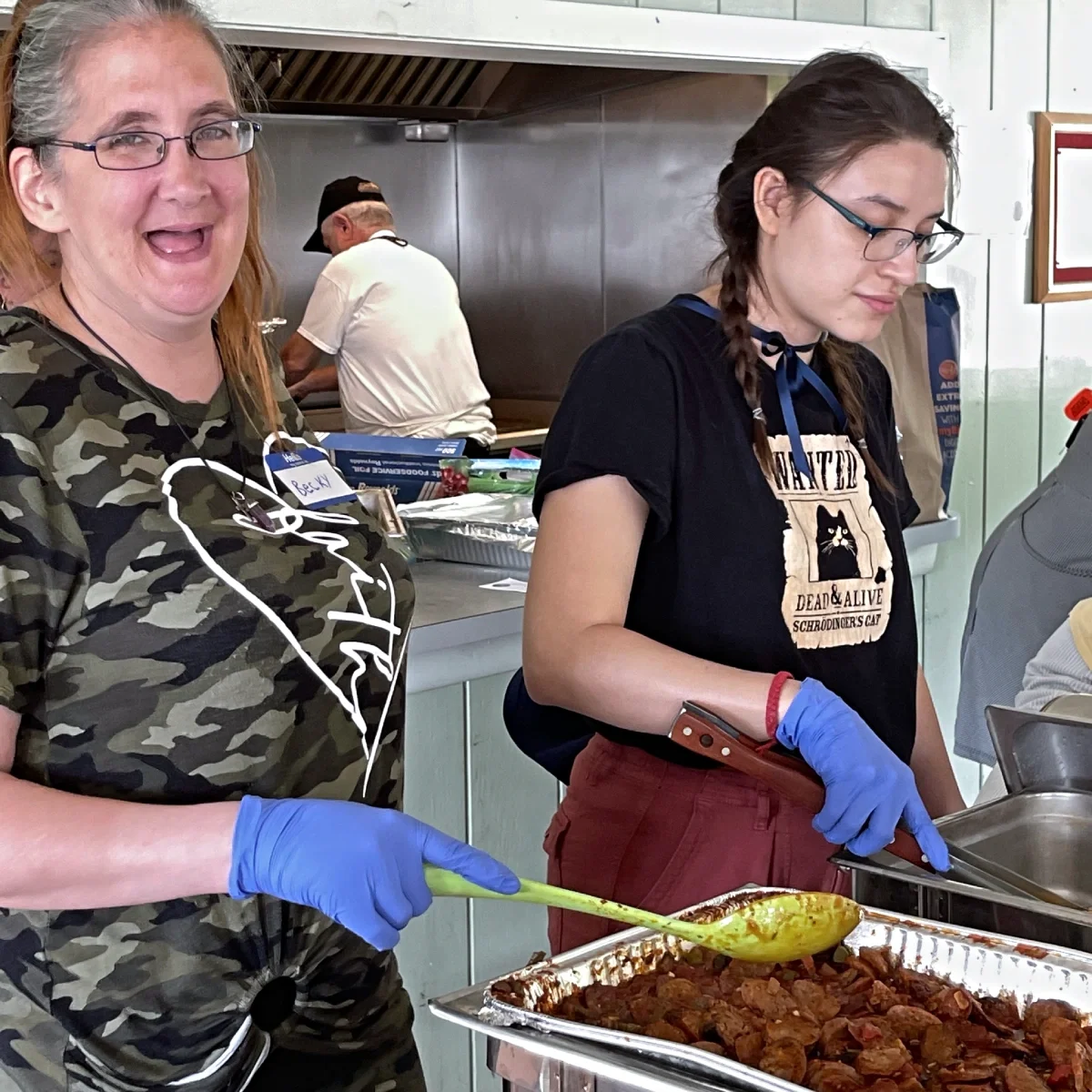 Two women serving food