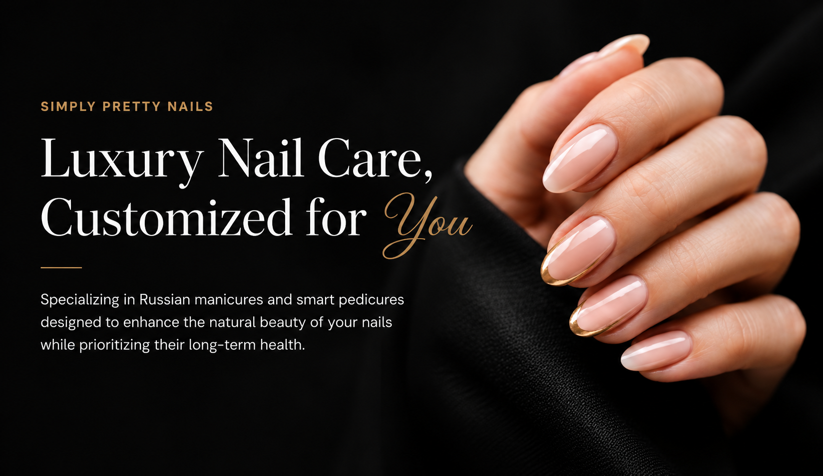 Close-up of a woman's hand with manicured nails, featuring a French tip design with gold accents, set against a black background, promoting luxury nail care.