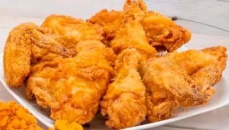 A plate of fried chicken pieces, crispy and golden-brown.