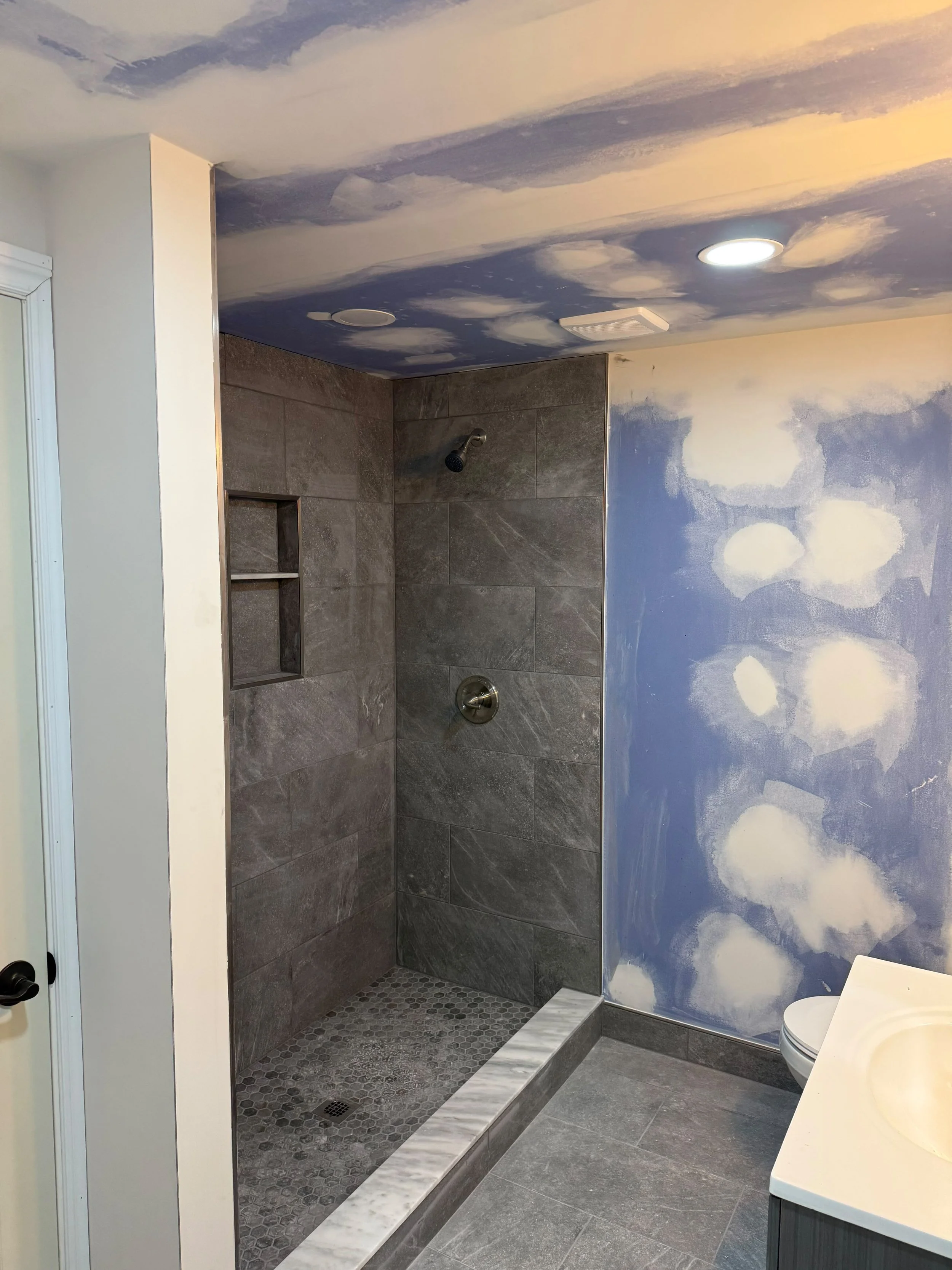 High-quality craftsmanship showcased through premium tile work, smooth finishes, and throughtful lighting details.