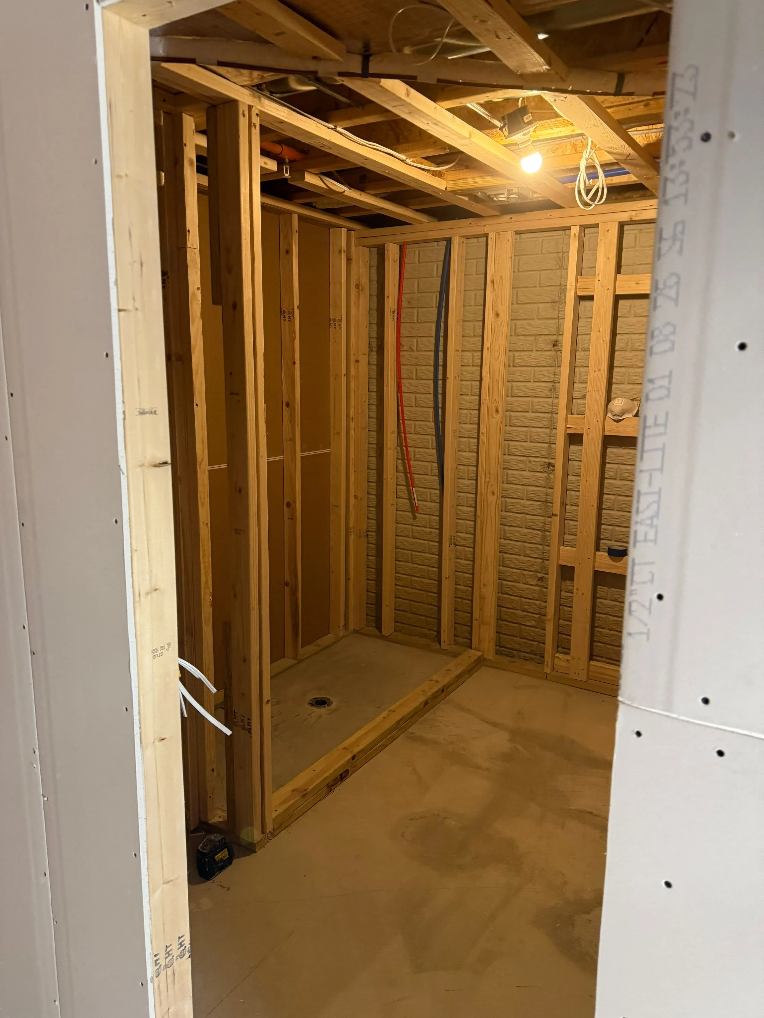 Interior hallway framed with precision, creating a functional layout that improves flow and maximizes usable space.
