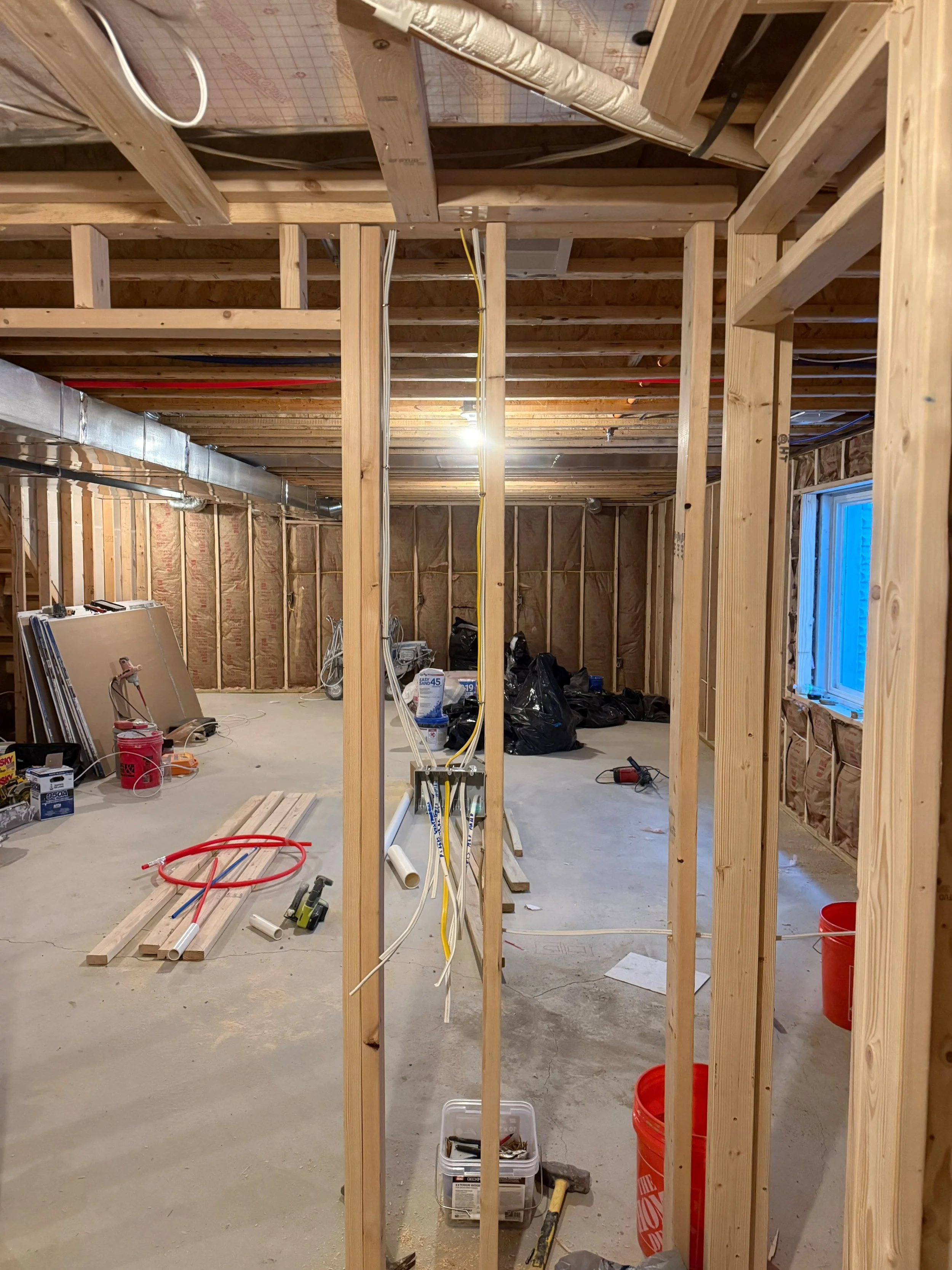 Custom wall framing installed to define new living space while ensuring a strong, durable structure for the finished basement.