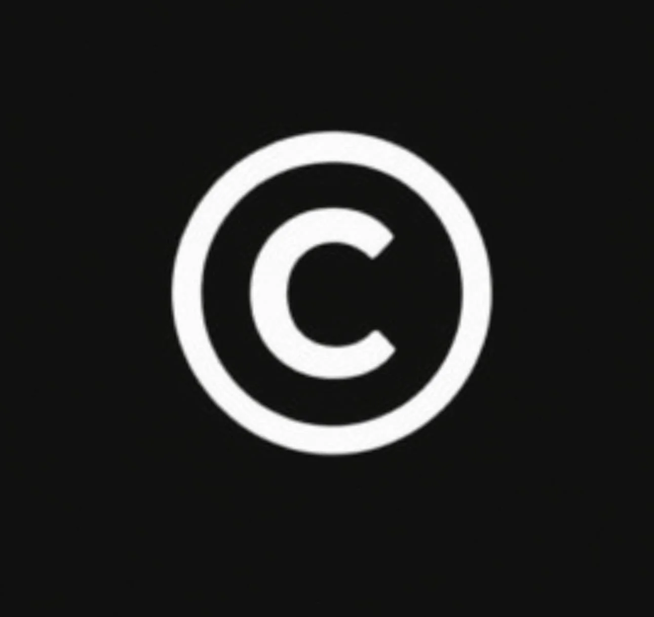 White copyright symbol on a black background.