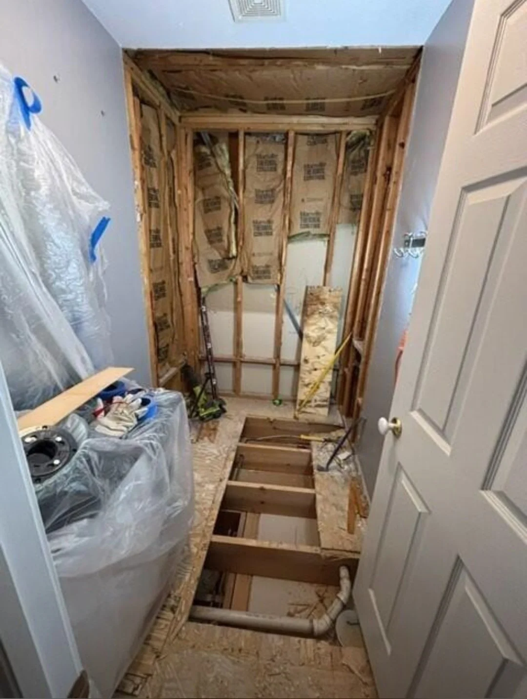 The demolition phase begins as outdated materials are removed , preparing the room for a brand-new custom renovation.