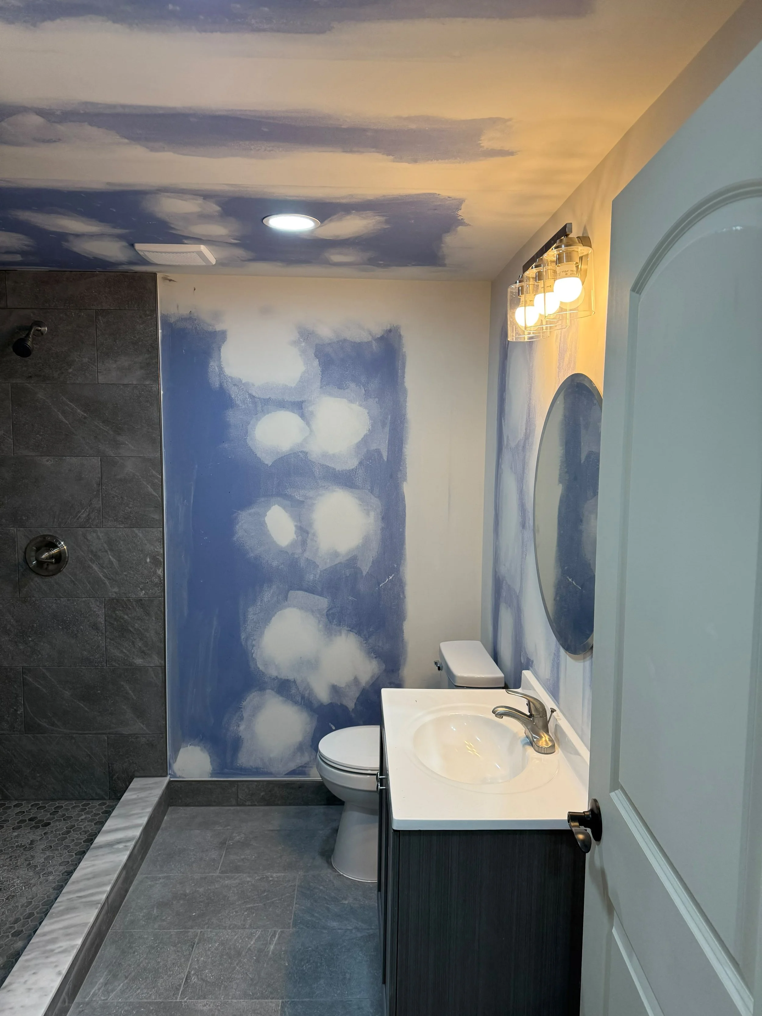 A stylish vanity paired with elegant finishes to create a functional and welcoming bathroom space.