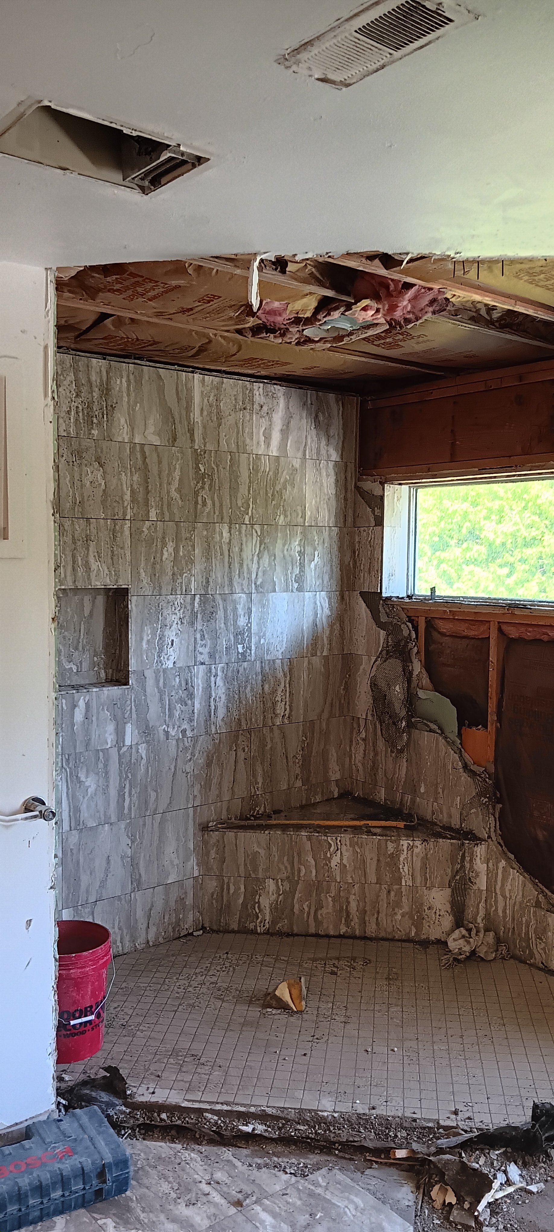 Bathroom walls and ceiling opened during the complete remodeling process.