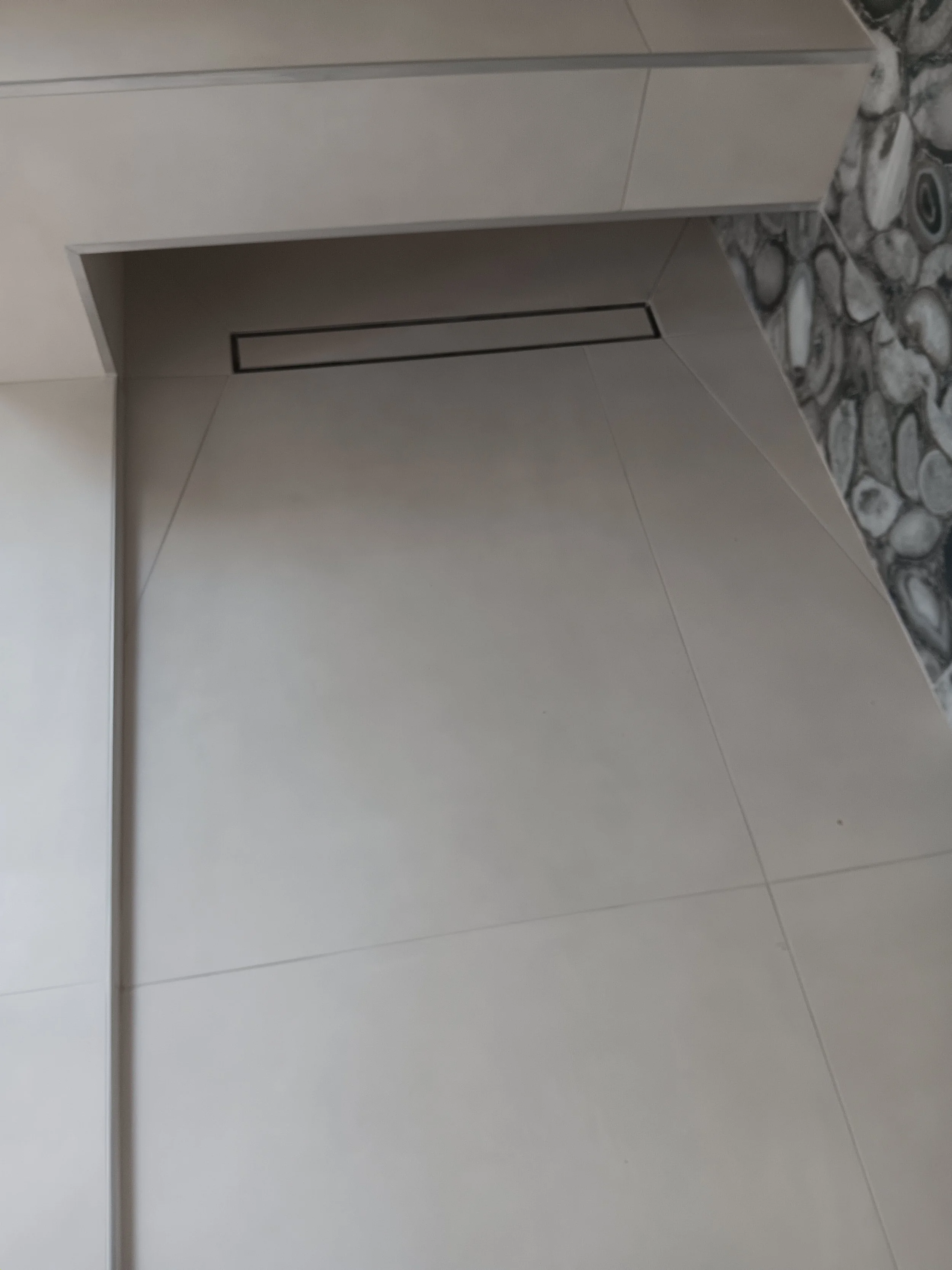 Waterproof shower walls and floor ready for the finishing materials.