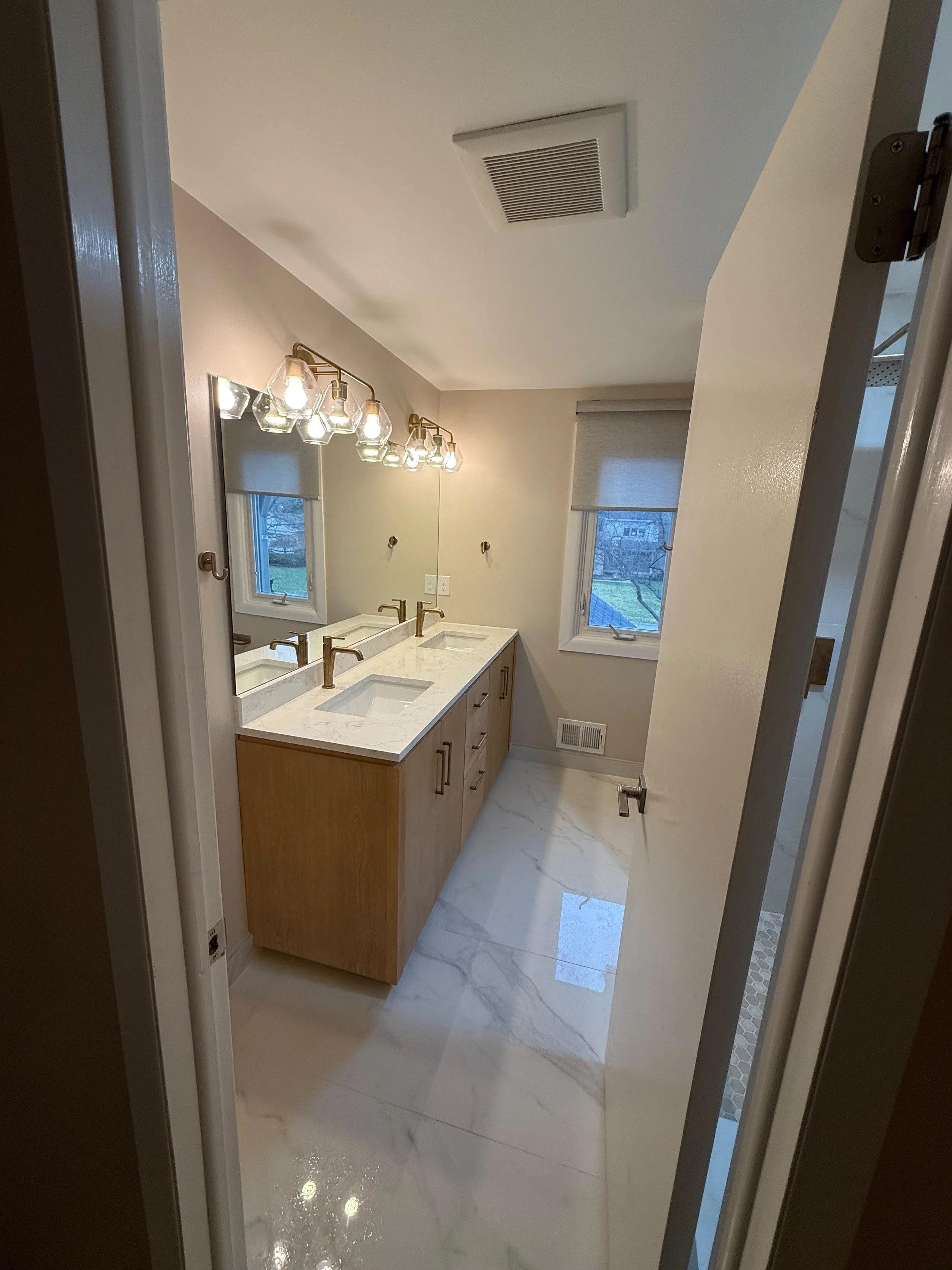 Beautiful modern bathroom completed by Edil Gjoni Remodeling in Rochester , MI.