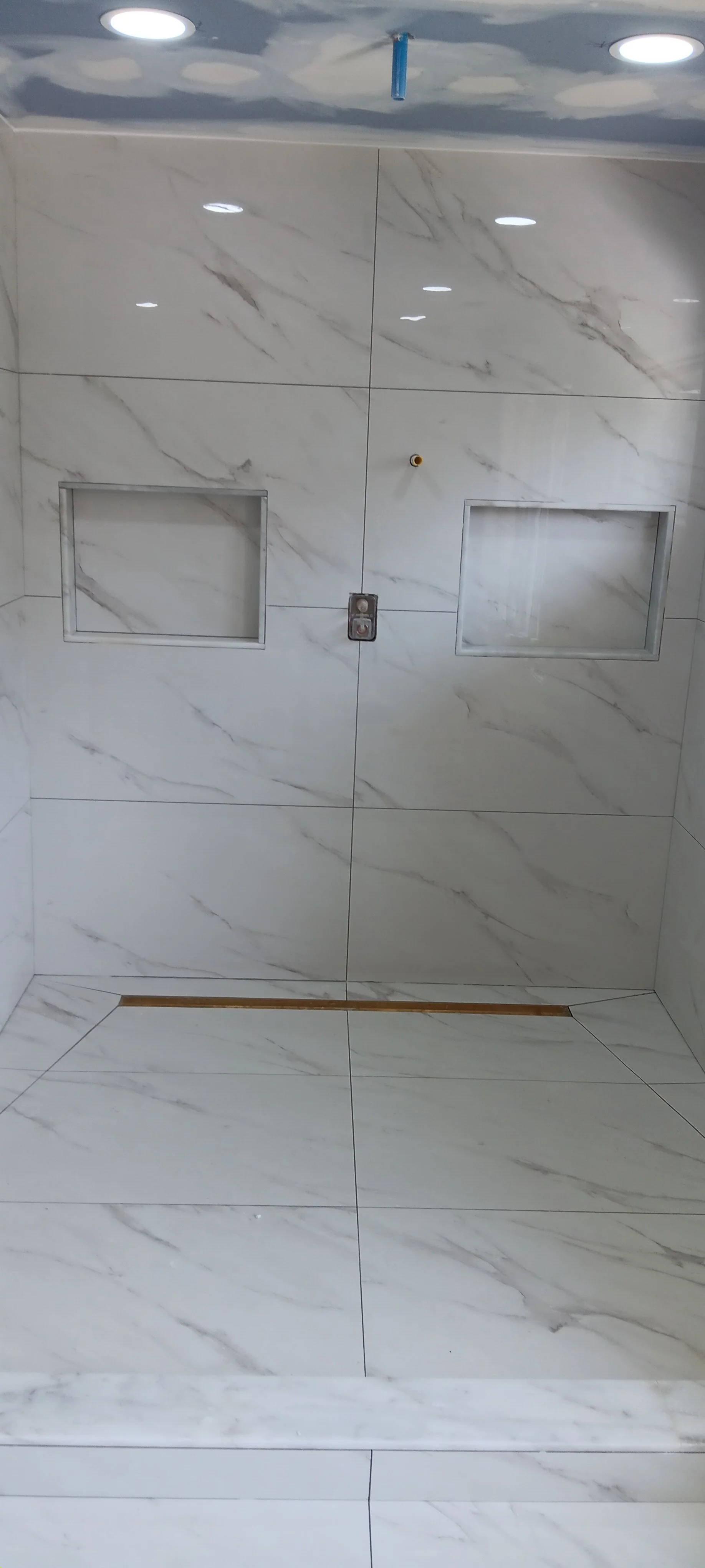 Frameless glass shower enclosure installed for a clean and open appearance.