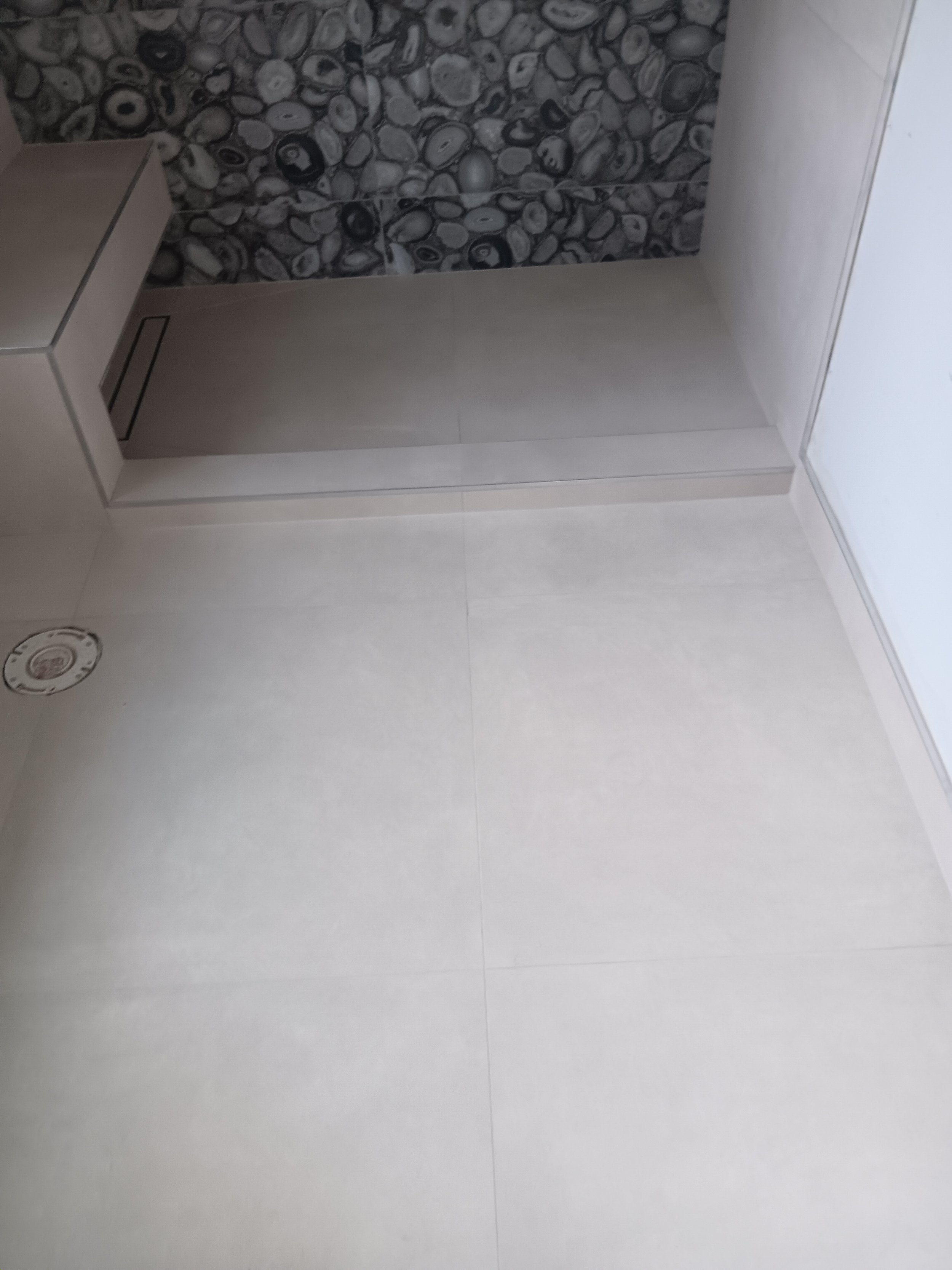 Clean shower base preparation designed for proper drainage and durability.