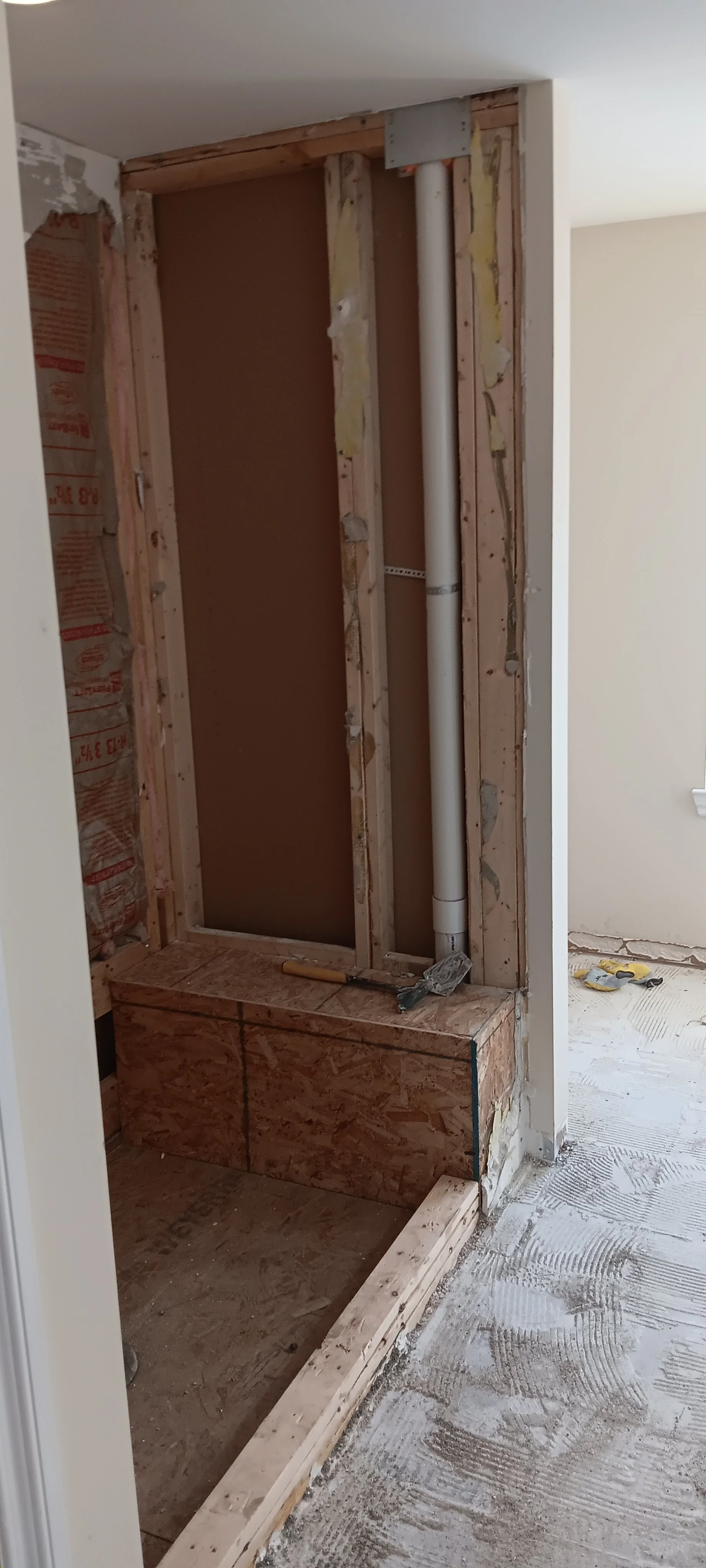 Exposed wall framing during preparation for the new bathroom layout.