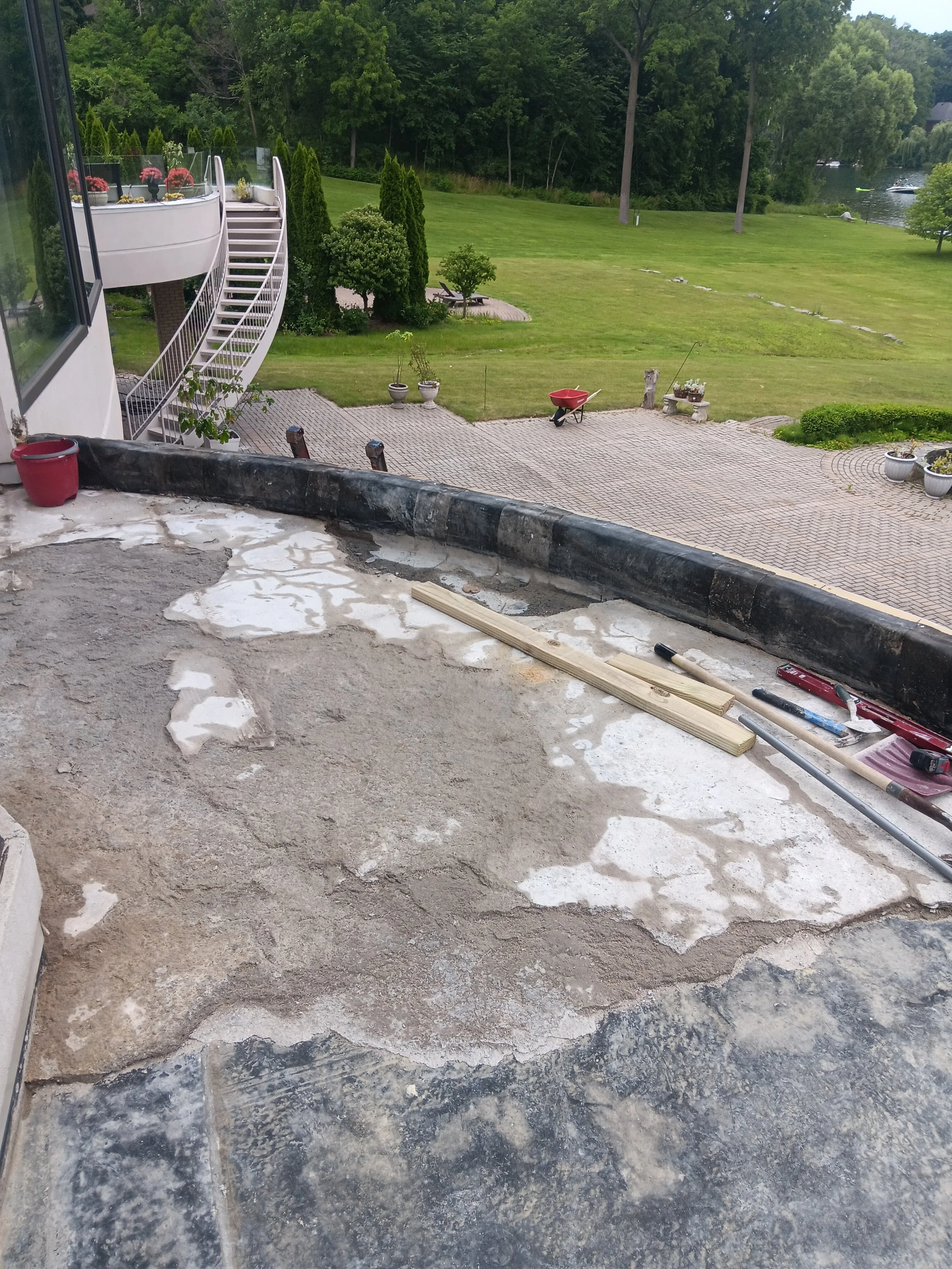 Curved balcony surface prepared and repaired before the application of the final protective finish.