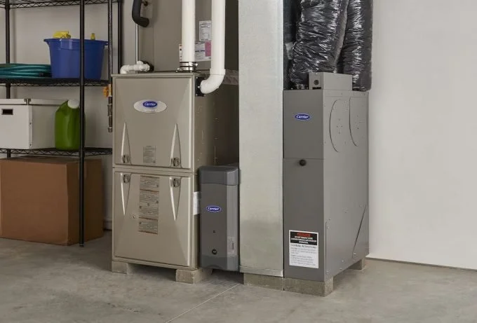 HVAC system with furnace and ductwork in a garage or utility room.