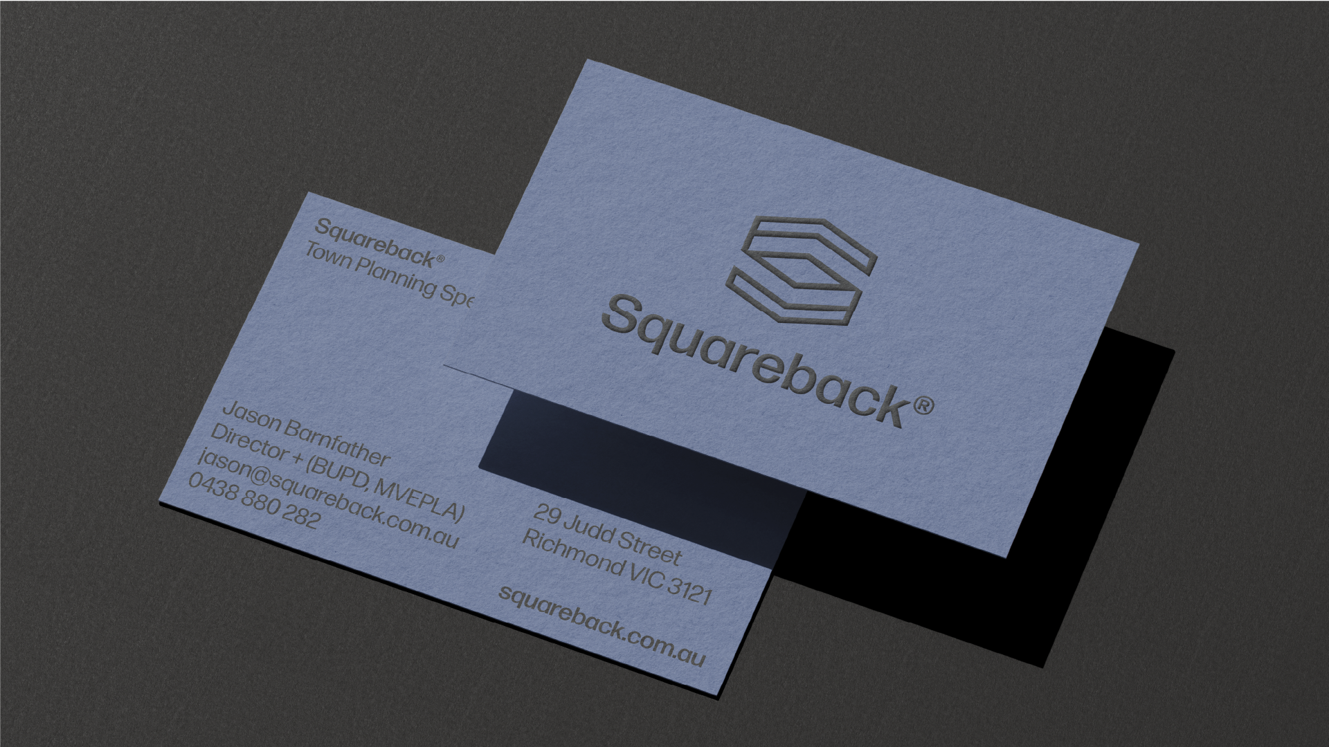 Business card for Squareback with logo, name, title, contact information, and address on a dark background.