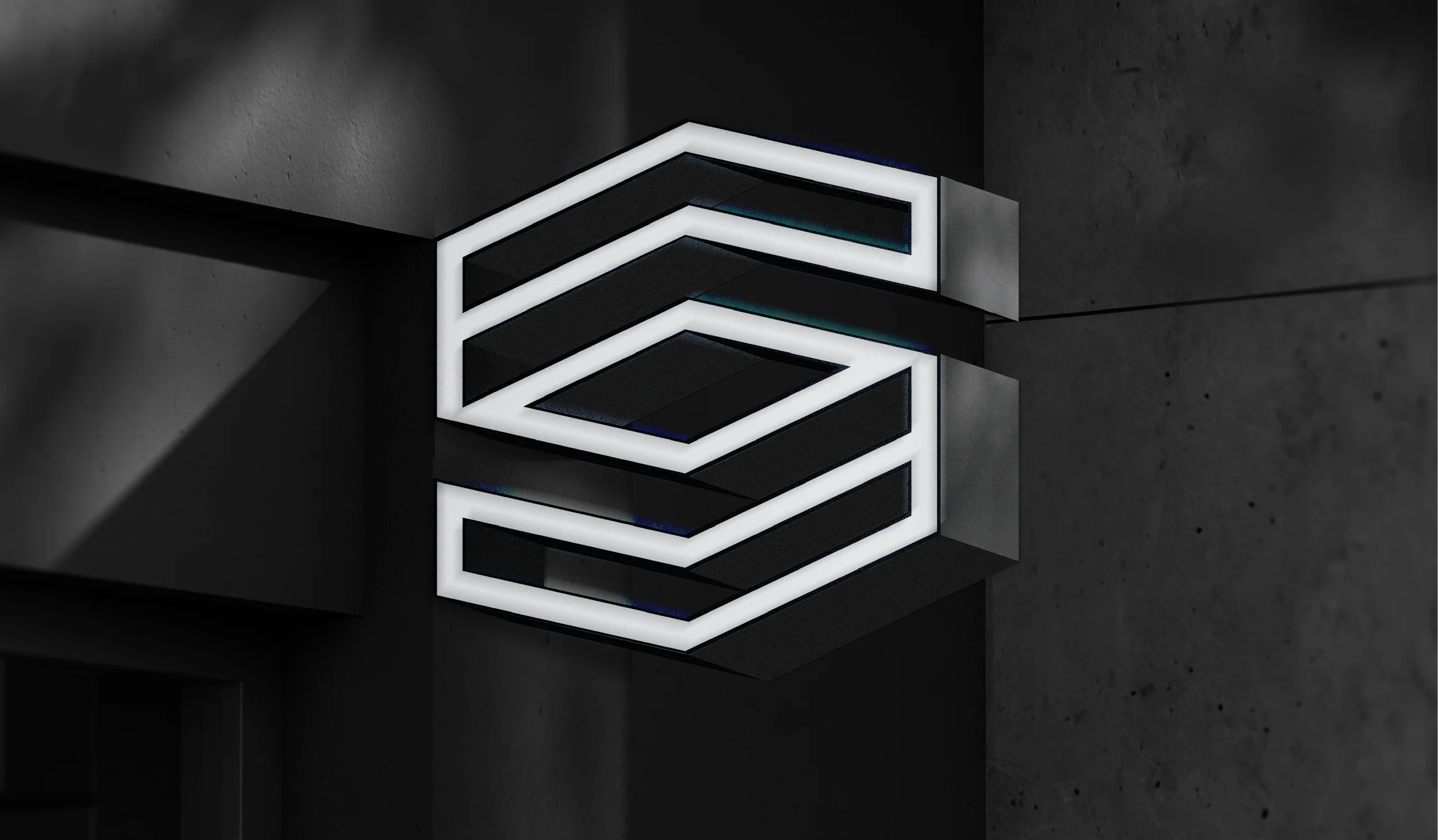 Modern black and white geometric wall sculpture with illuminated edges on a dark wall.
