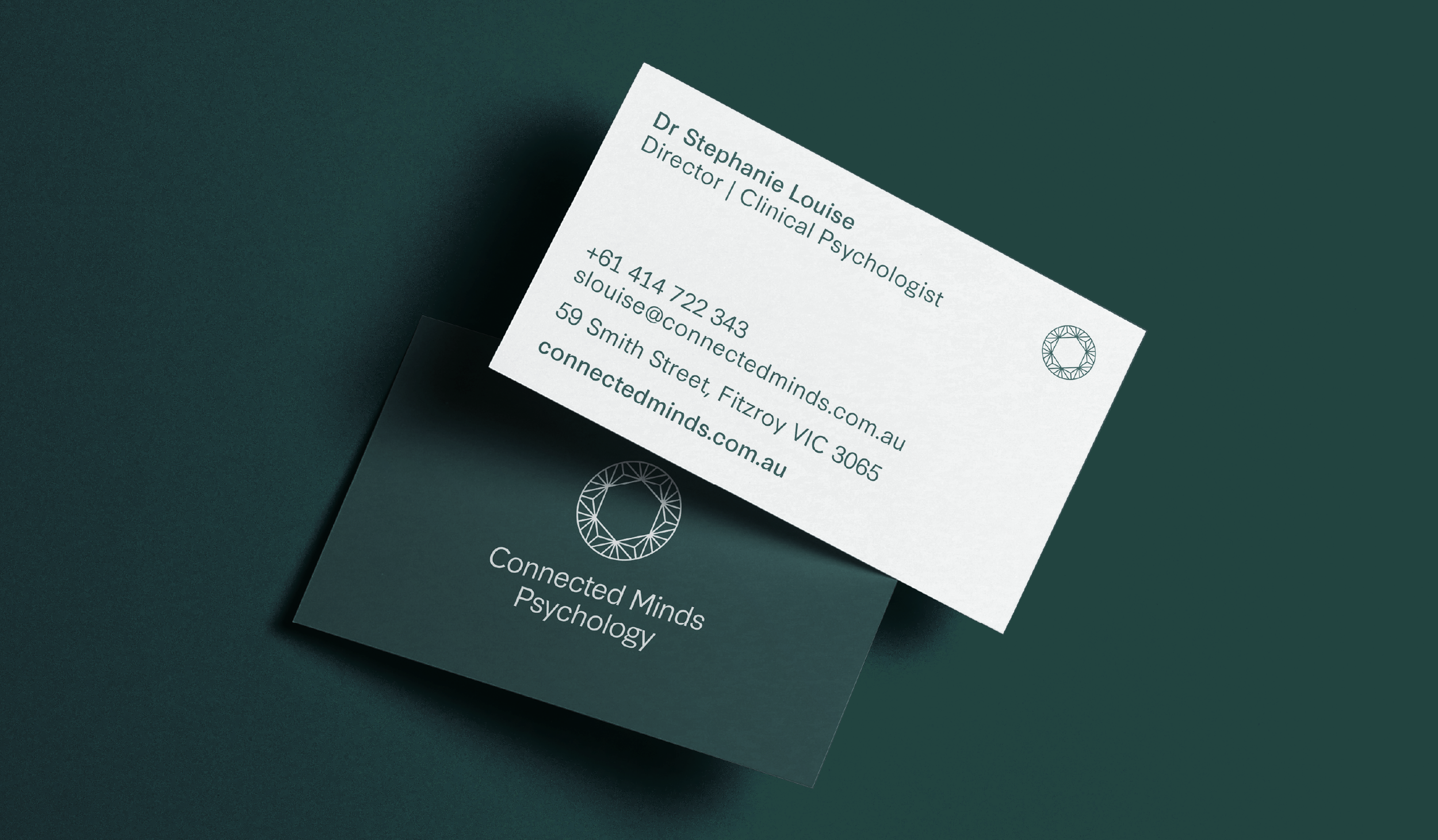 Business cards for Connected Minds Psychology, with one card displaying contact information for Dr. Stephanie Louise, a clinical psychologist, on a dark green background.