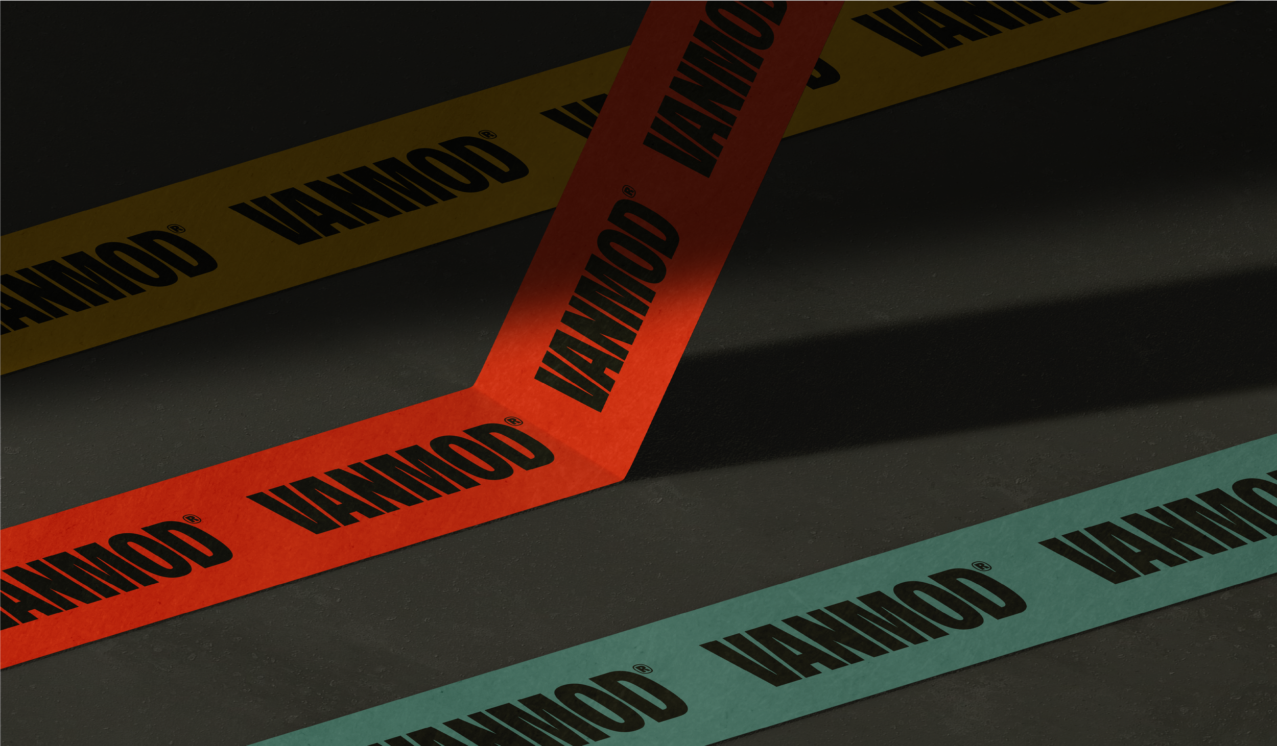 Close-up of black surface with yellow, red, and blue caution tape labeled 'Caution' in black text.