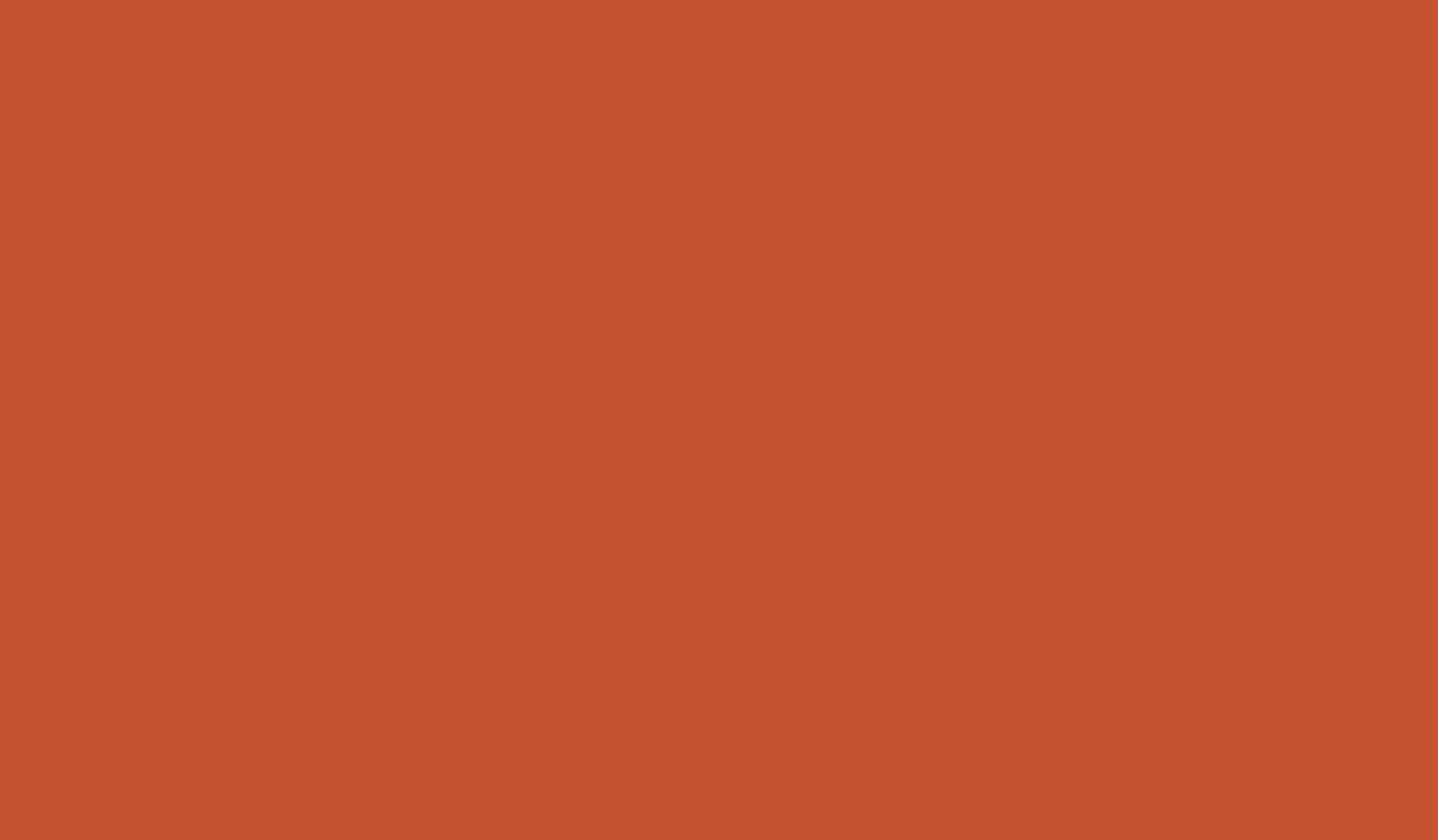 A painter's palette with a variety of colors and two paintbrushes.