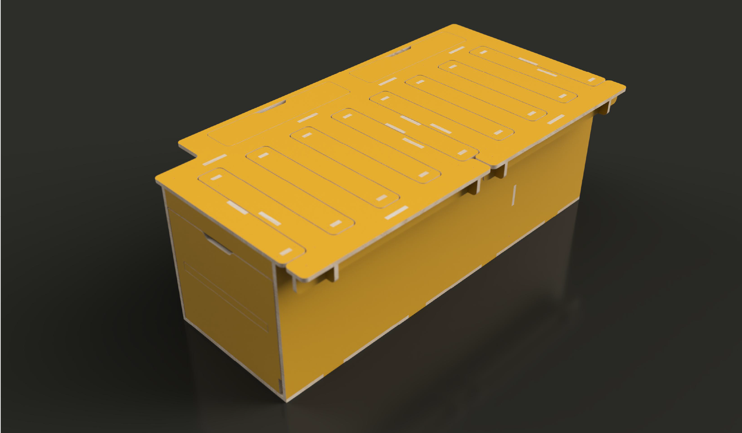 Yellow cardboard or plastic container with cutout handles on the sides, viewed from above against a dark background.