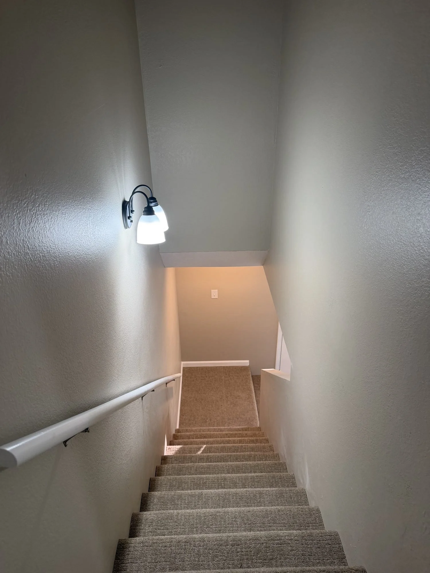  Carpeted staircase in this Lebanon, MO townhouse rental. 