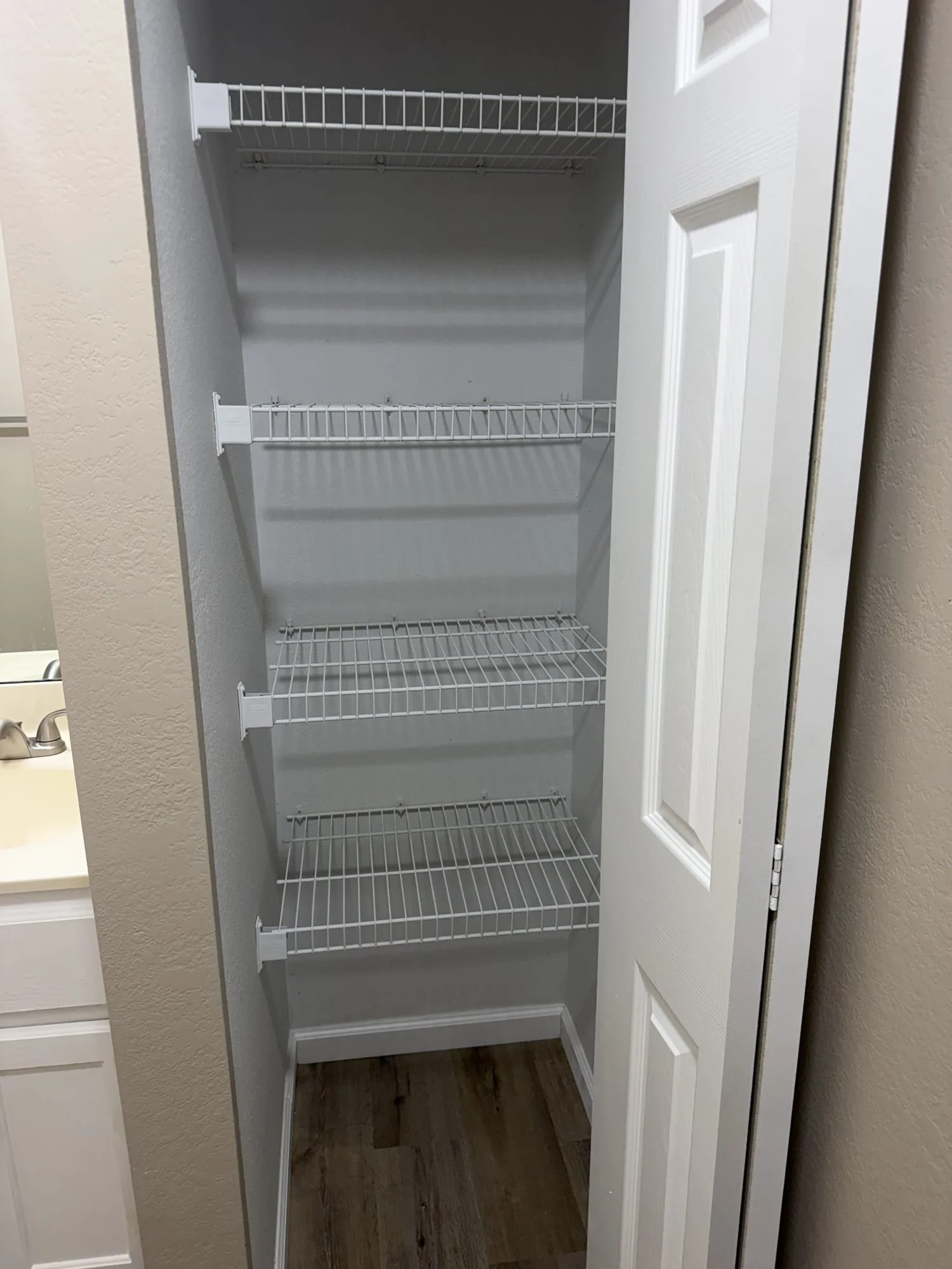  Linen closet with wire shelving in this Lebanon, MO rental. 