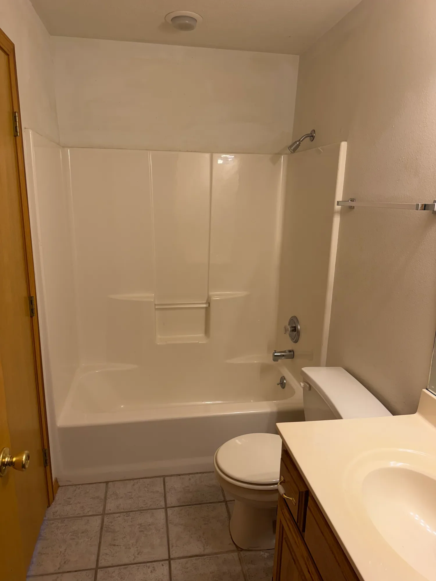  Bathroom with tub and shower combo, vanity and tile floor 