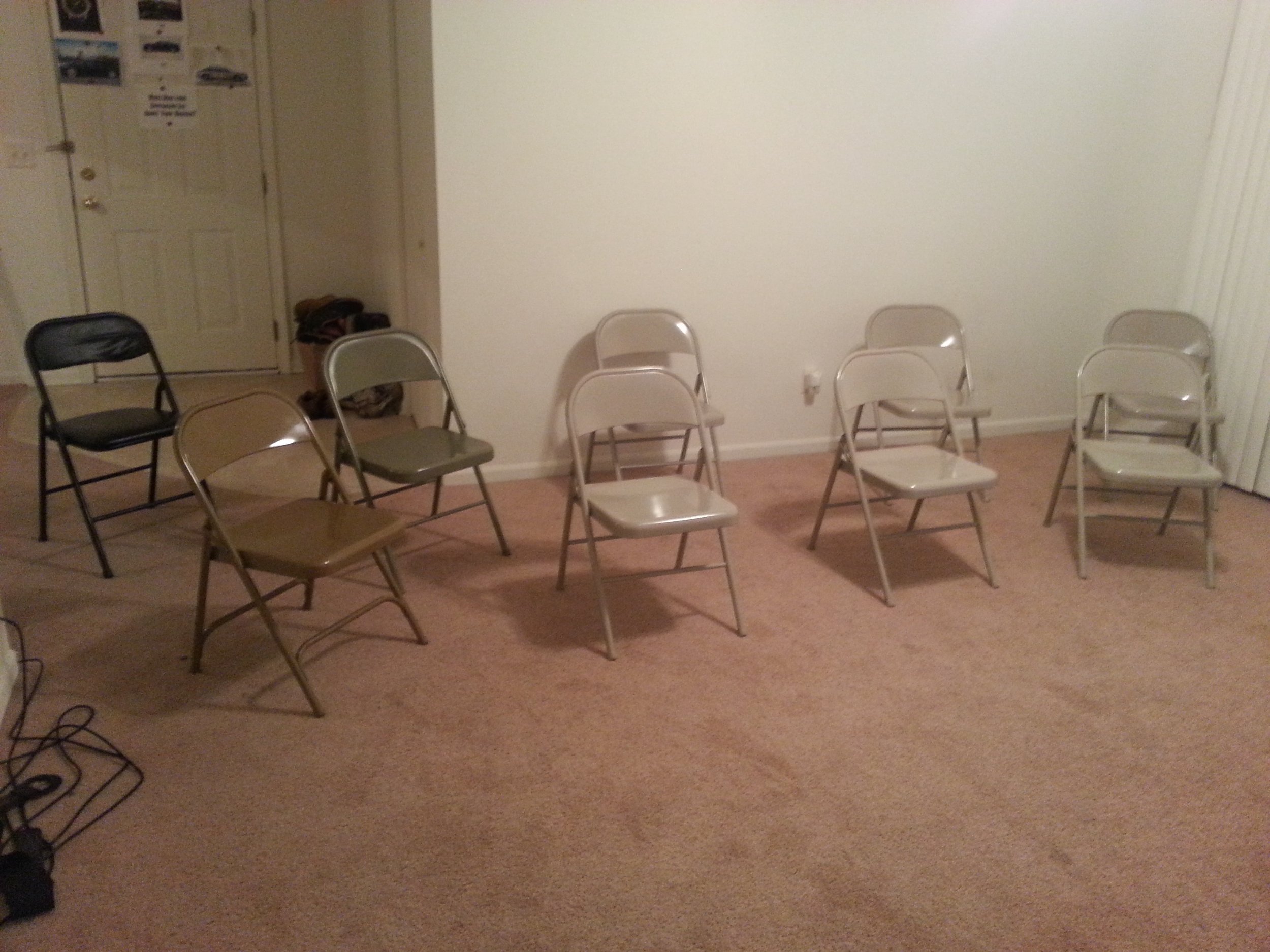 Humble beginnings - our apartment with no furniture except for chairs for our business presentations.