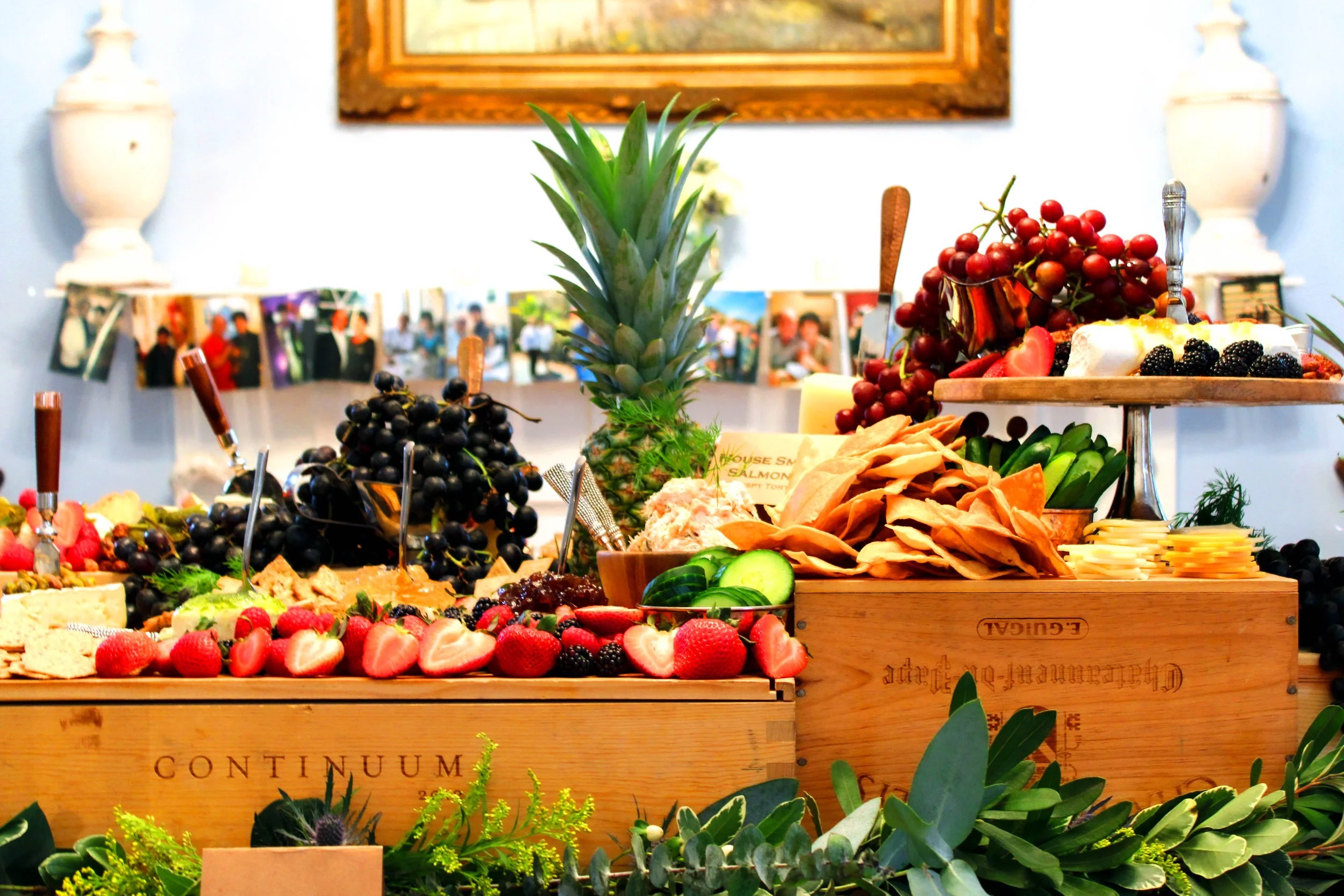 Abundant grazing table with fresh fruit, cheese and charcuterie at an Amelie Beau event