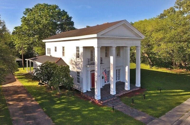 Historic white-columned Amelie Beau event venue exterior in Lutcher, Louisiana