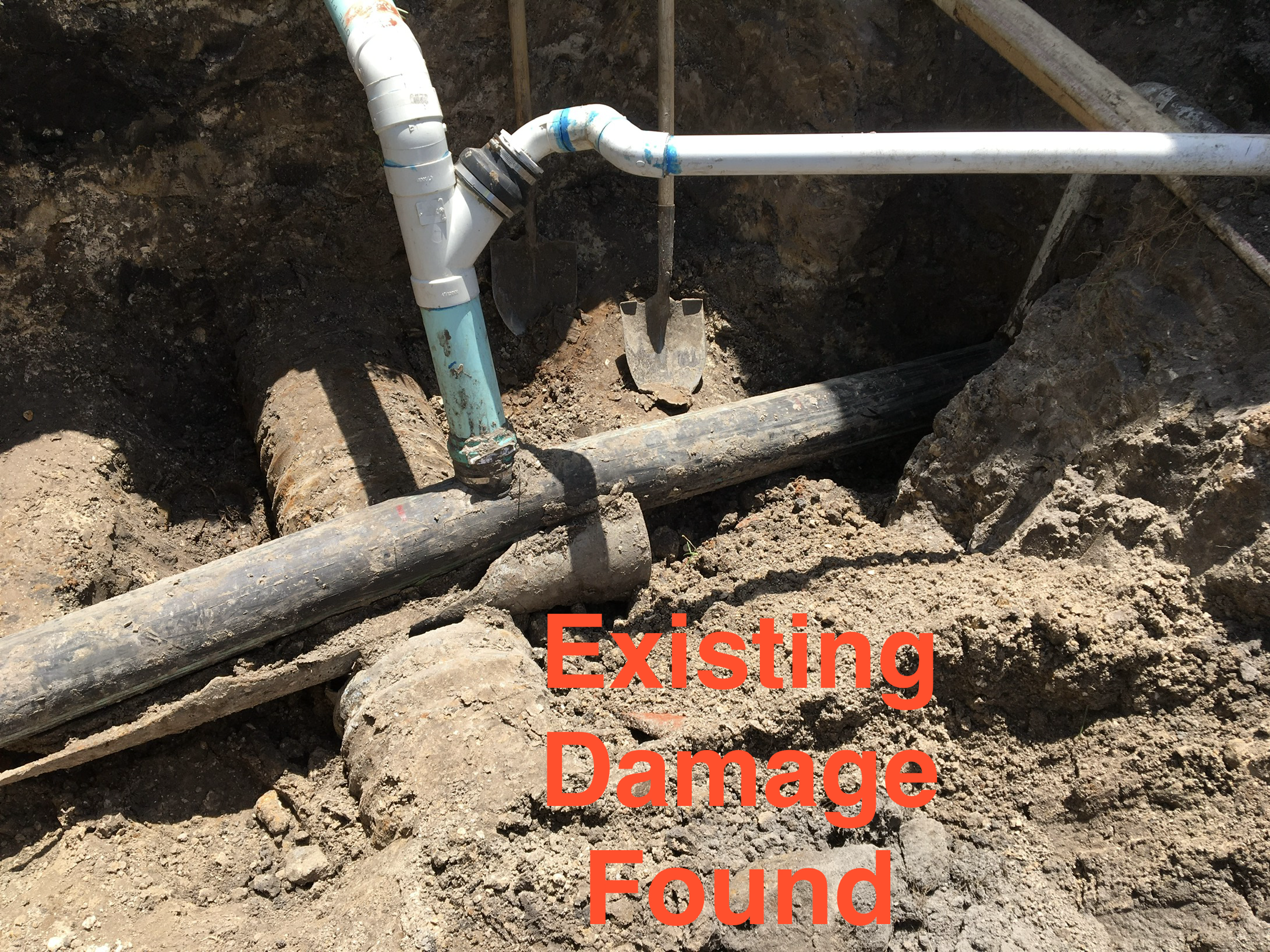 Underground pipe repairs with the words 'Existing Damage Found' overlayed in red text. Pipe damage found.