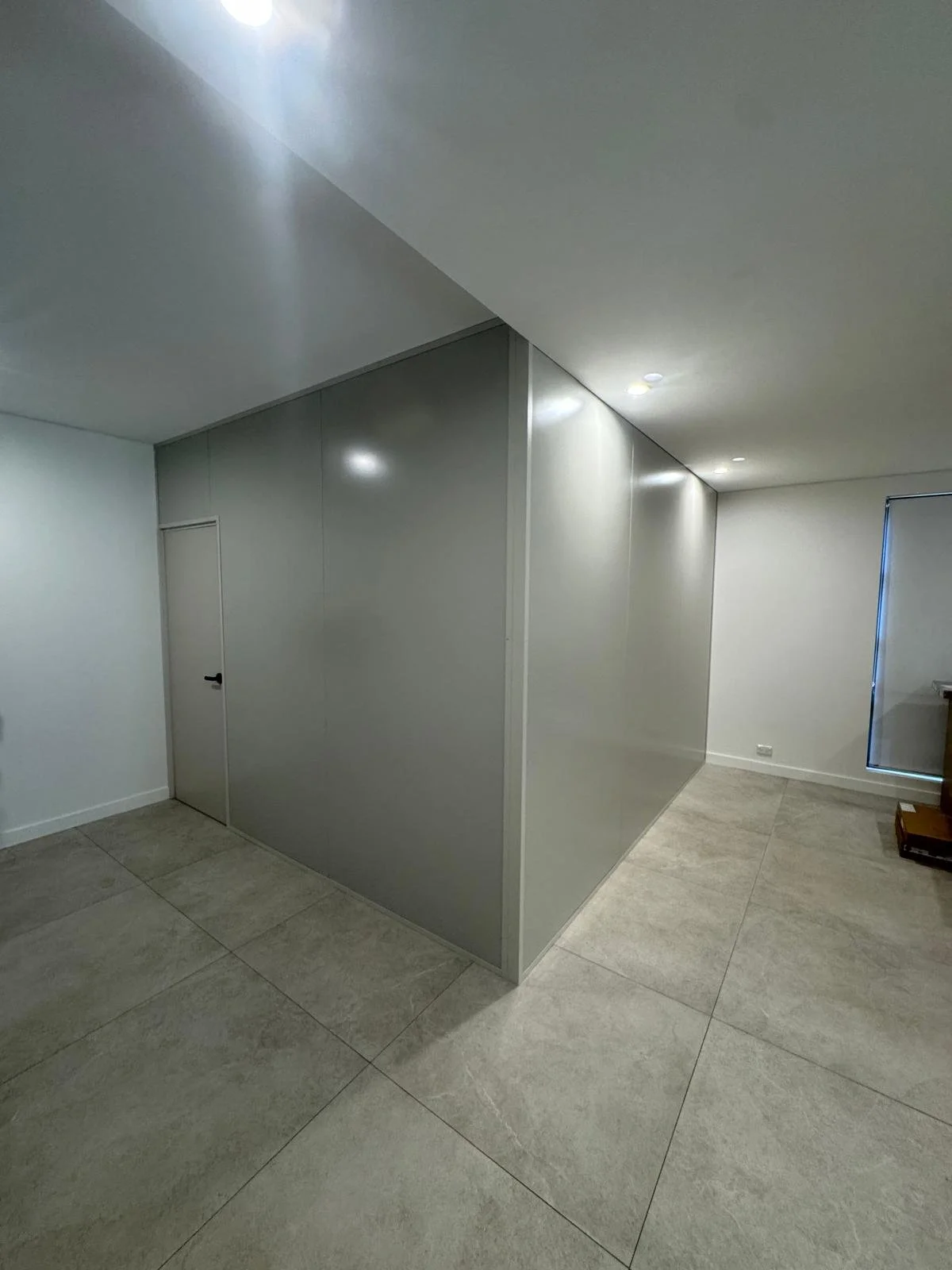 Insulated partition wall creating an additional bedroom in a Sydney home