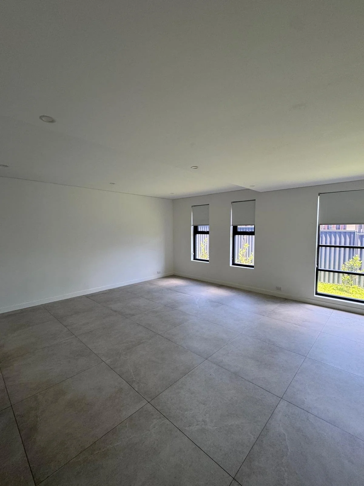 Living room area before installing a partition wall to create an extra bedroom 