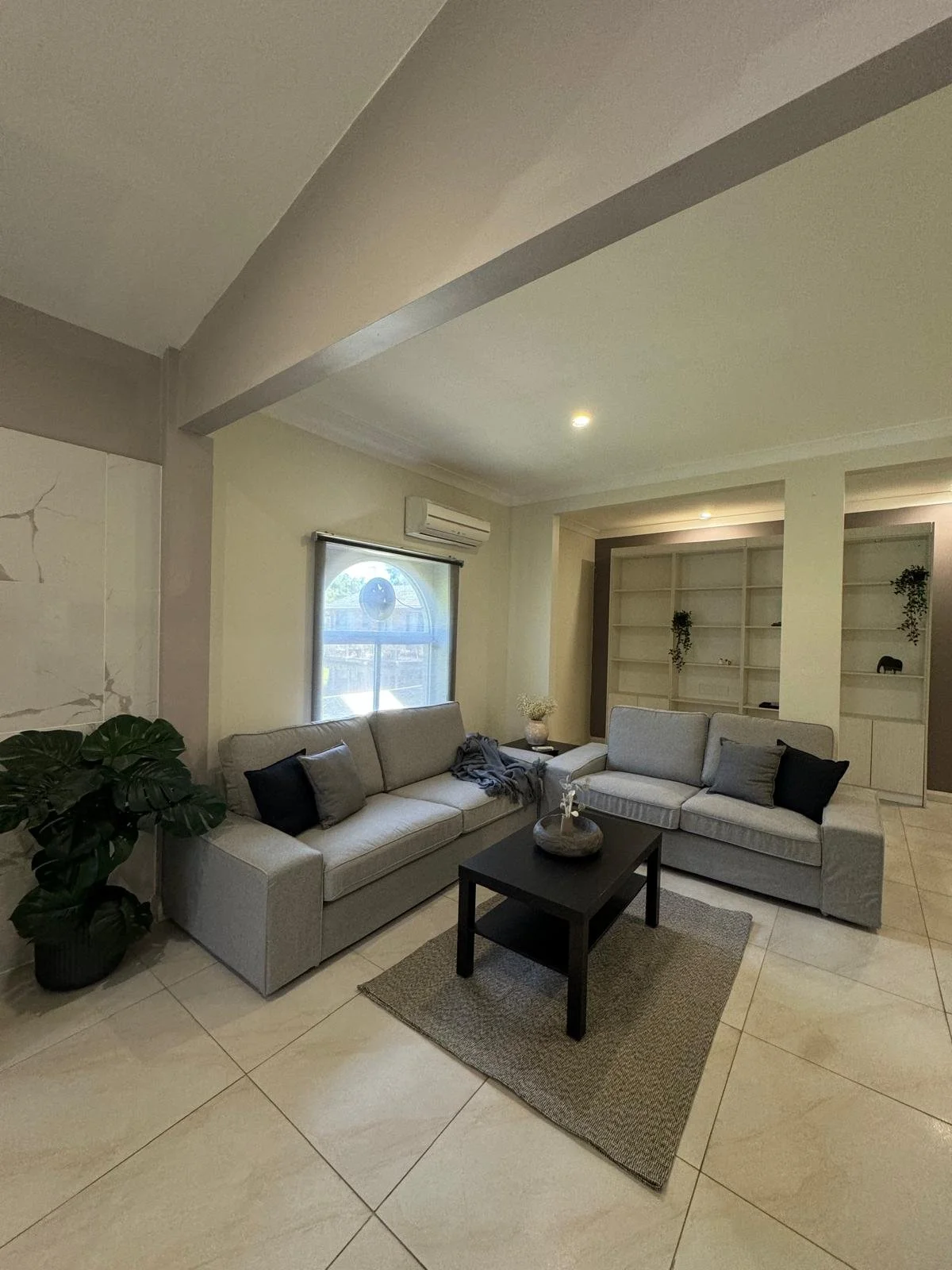     Modern furnished living room in a Sydney investment property completed by Terravex Group
