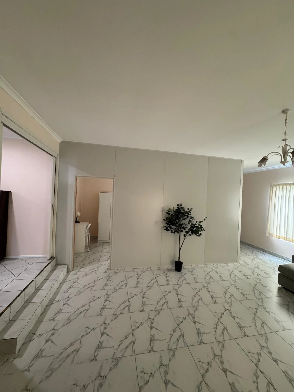 Insulated partition wall creating an additional bedroom in a Sydney home