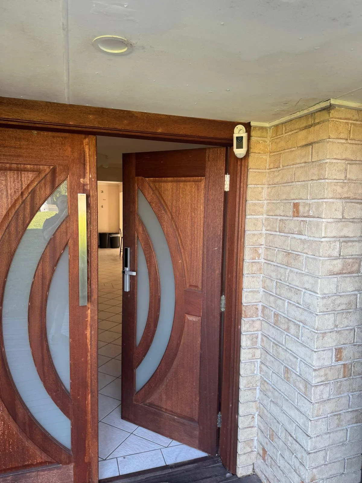 Front door wireless camera and smart lock installed at Acacia Gardens