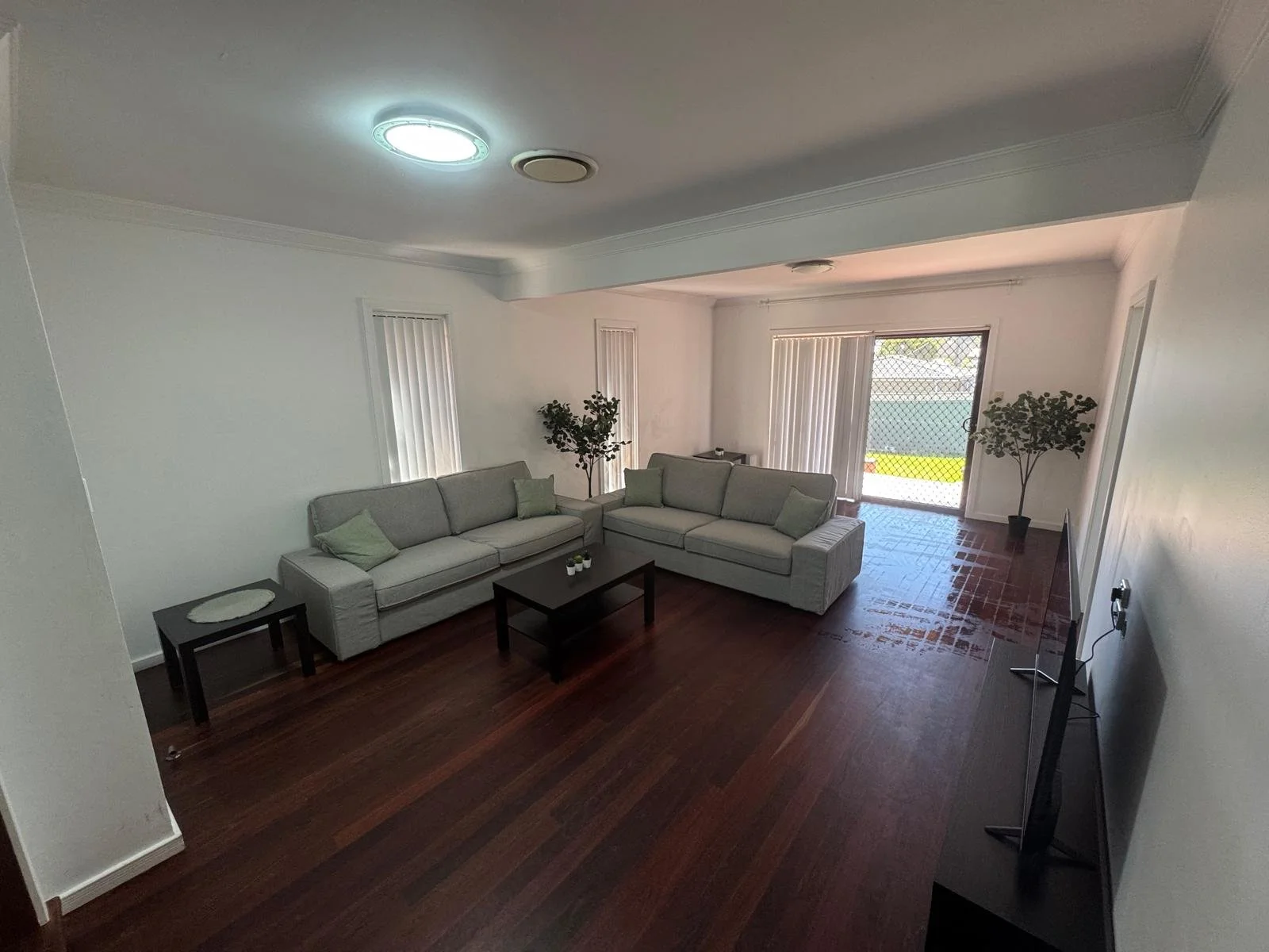     Modern furnished living room in a Sydney investment property completed by Terravex Group