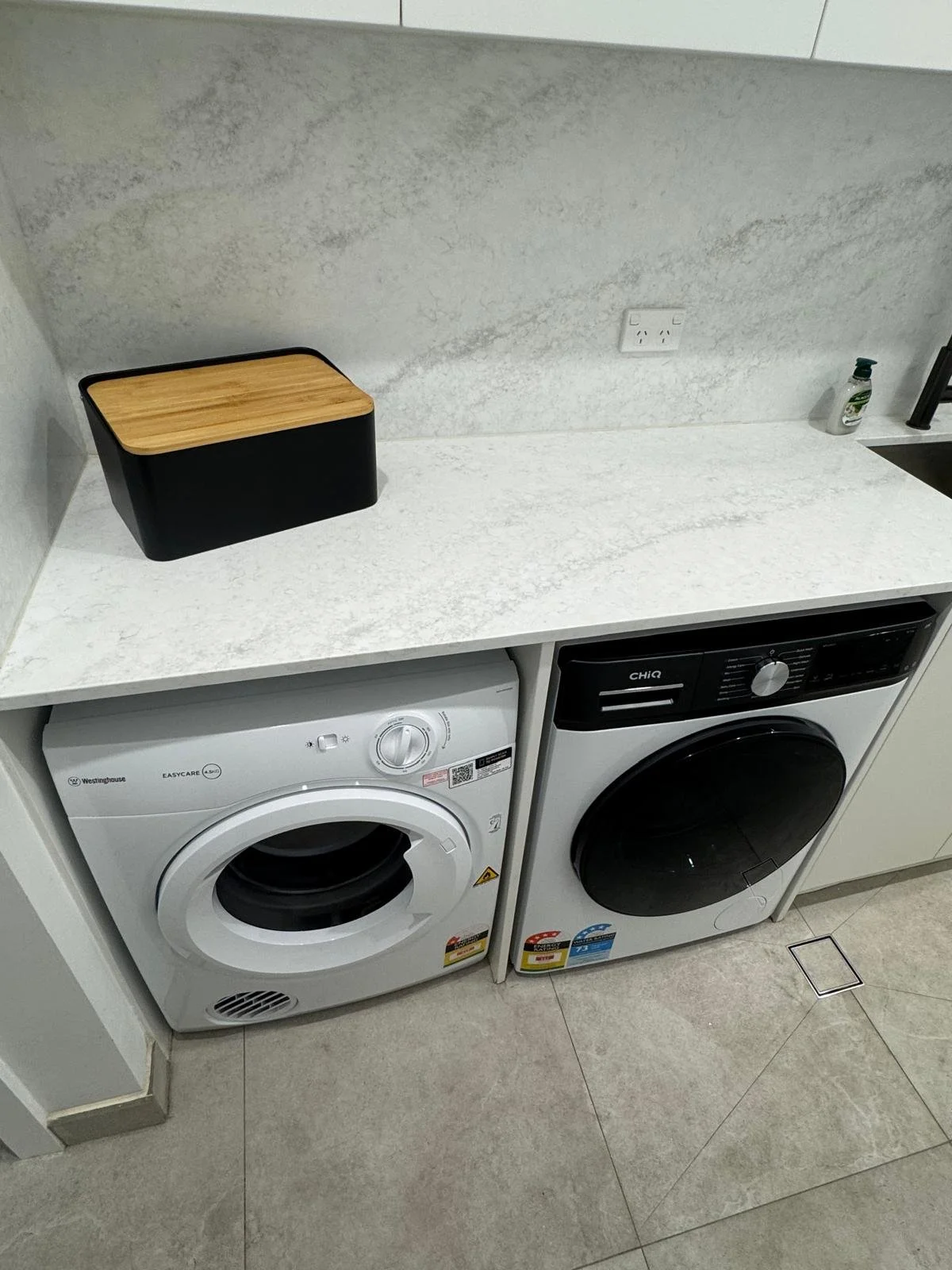     Washing machine and dryer installed in a Sydney Air Bnb property by Terravex Group