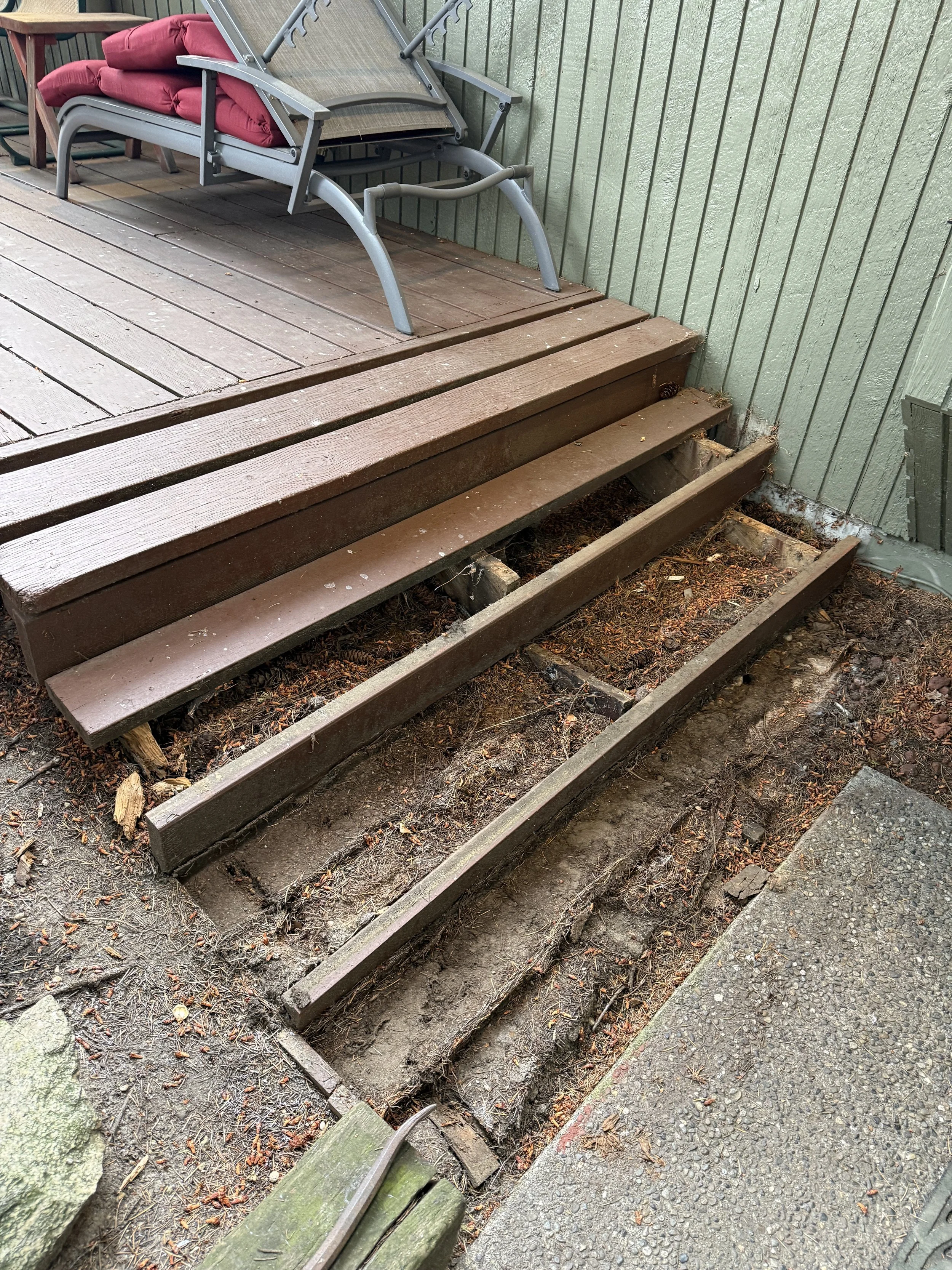 Deteriorated stair stringers revealed the extent of the damage and the need for a full rebuild.
