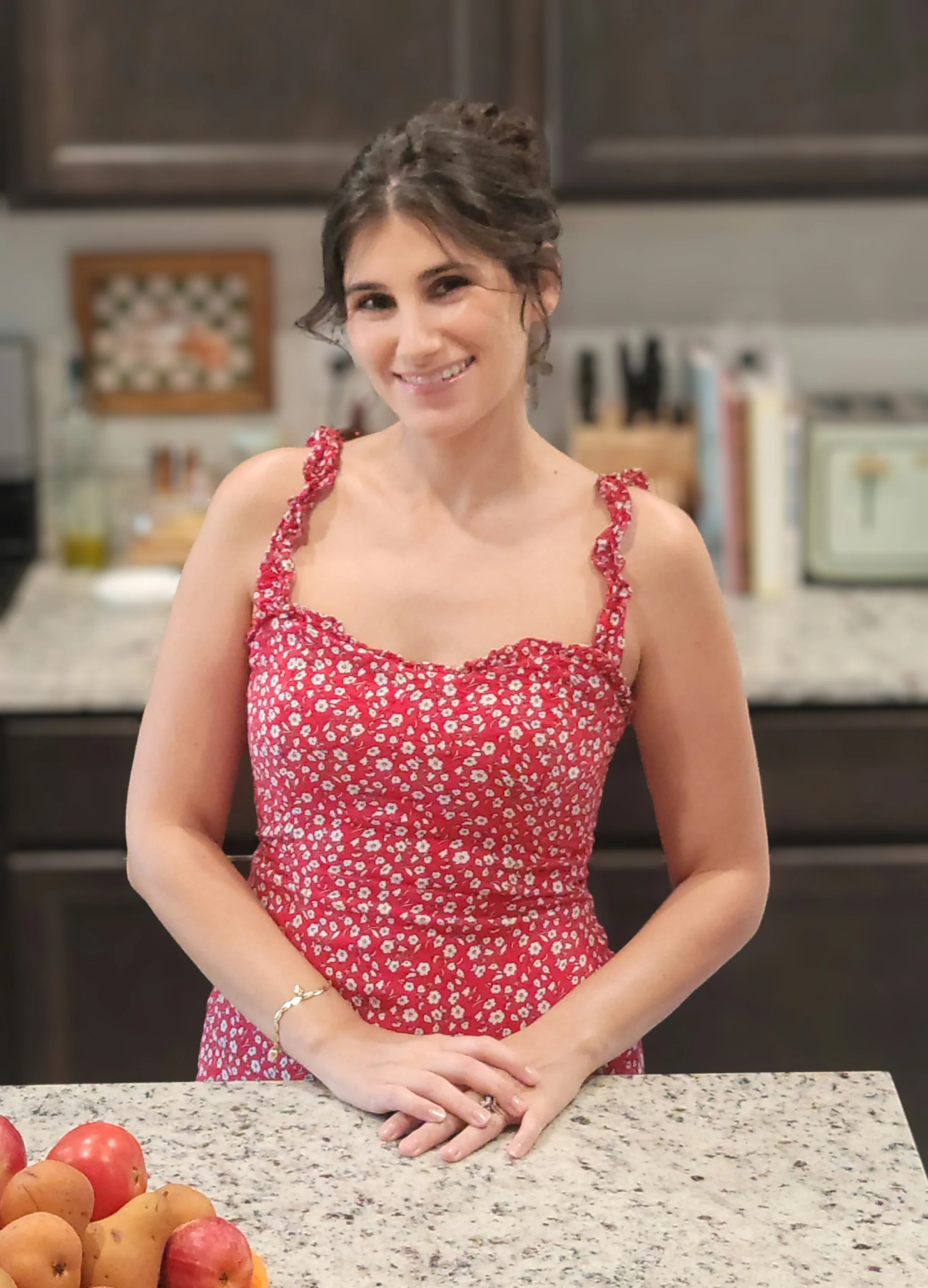 Jessica, the baker behind Copper Oven Kitchen, smiling in her kitchen