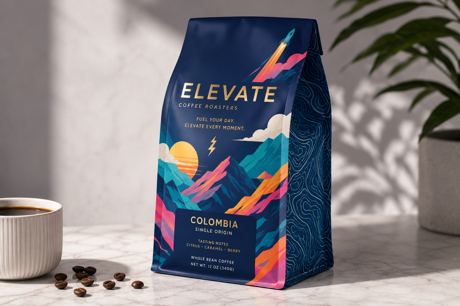 A bag of Elevate Coffee Roasters Colombian whole bean coffee, featuring colorful mountain and sun graphics, on a white marble surface next to coffee beans and a cup of coffee.
