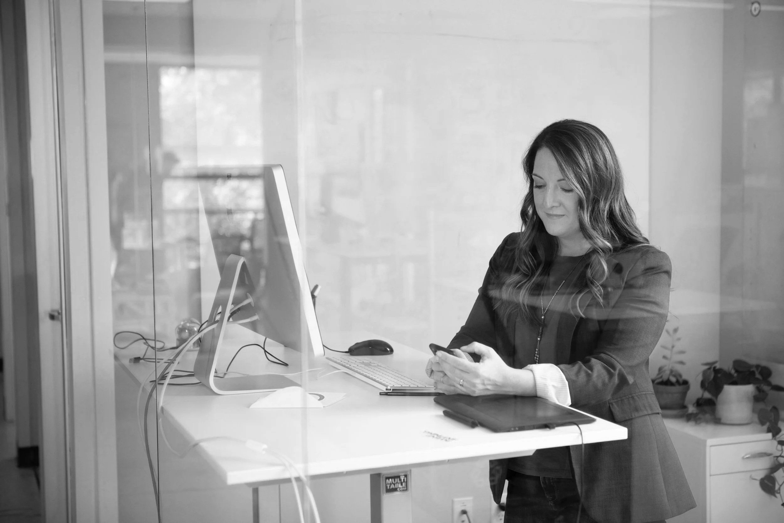 Founder reviewing professional content on a tablet at a desk