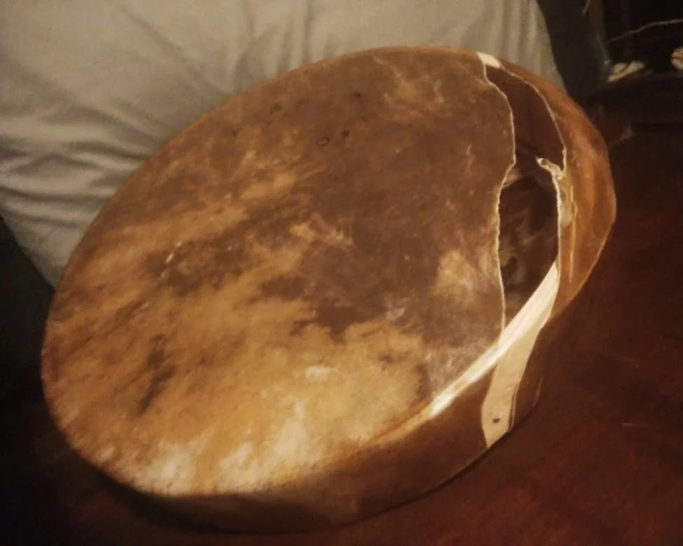 Broken drum with torn skin