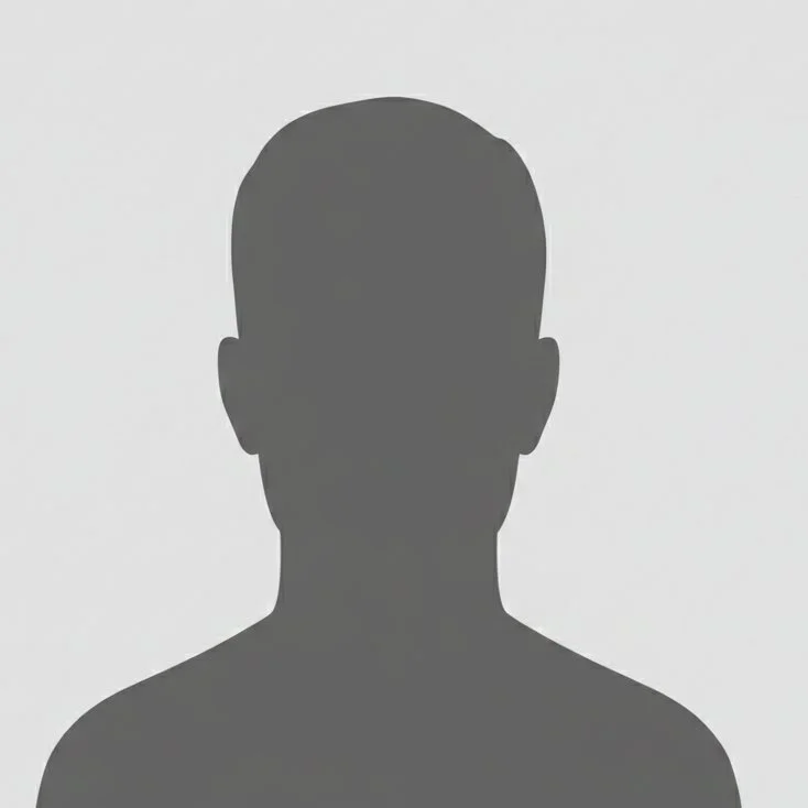 Silhouette of a person's head and shoulders against a plain background.