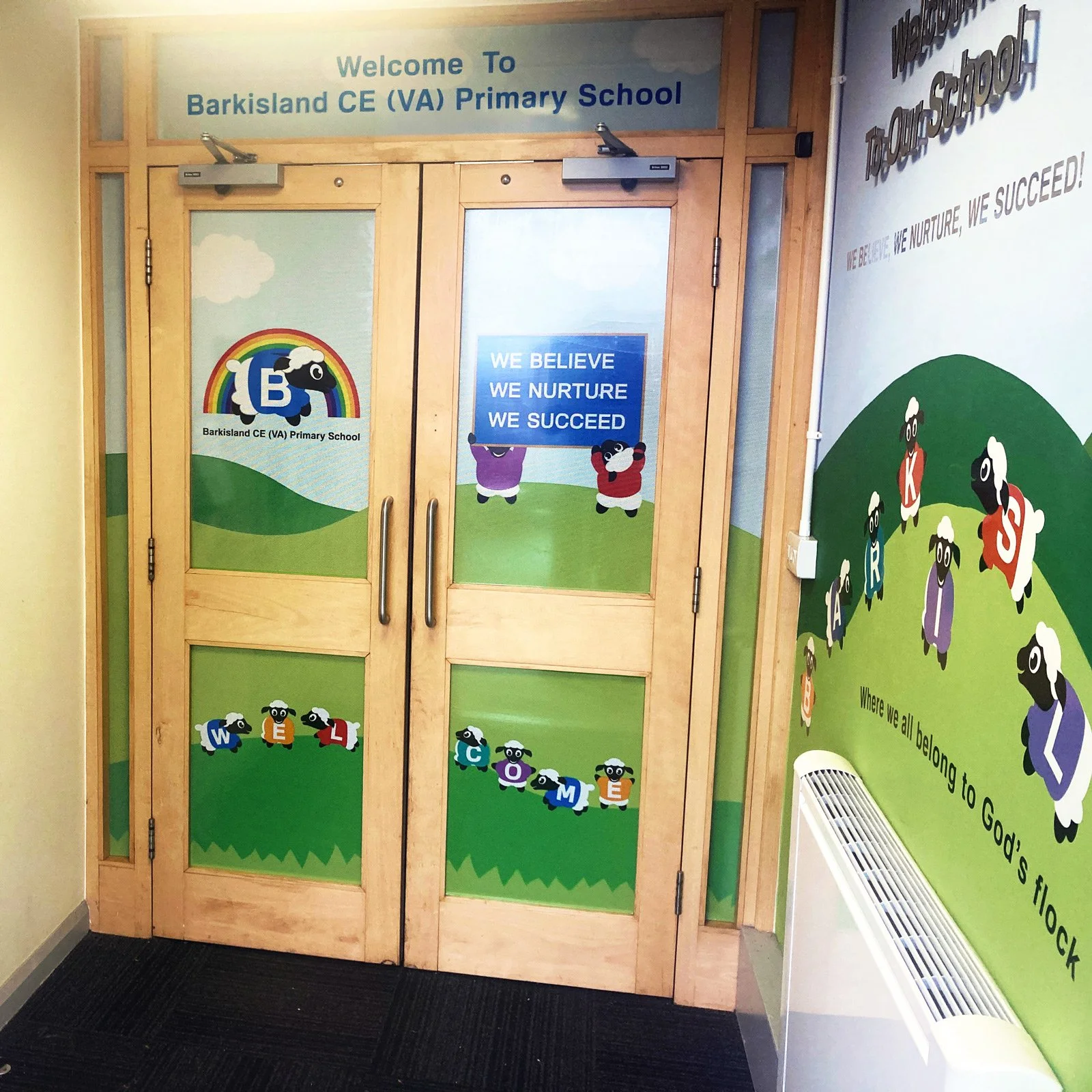 one-way privacy film for internal school glass panelled door matching the colourful wall graphics