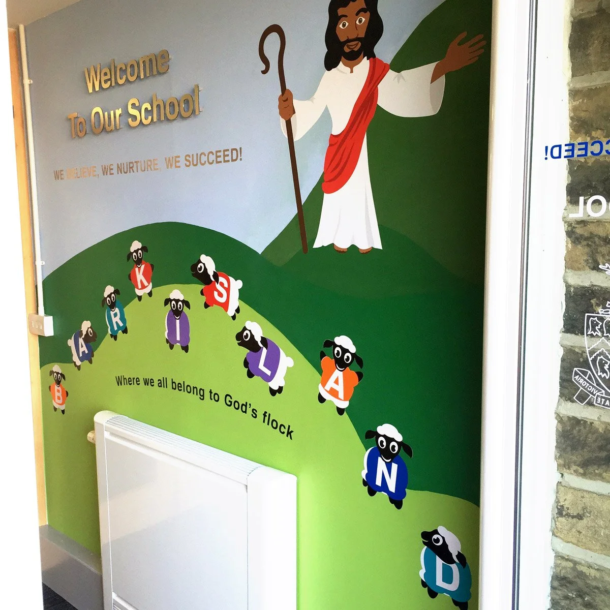 Welcoming school reception wall graphics for rural C of E Primary School