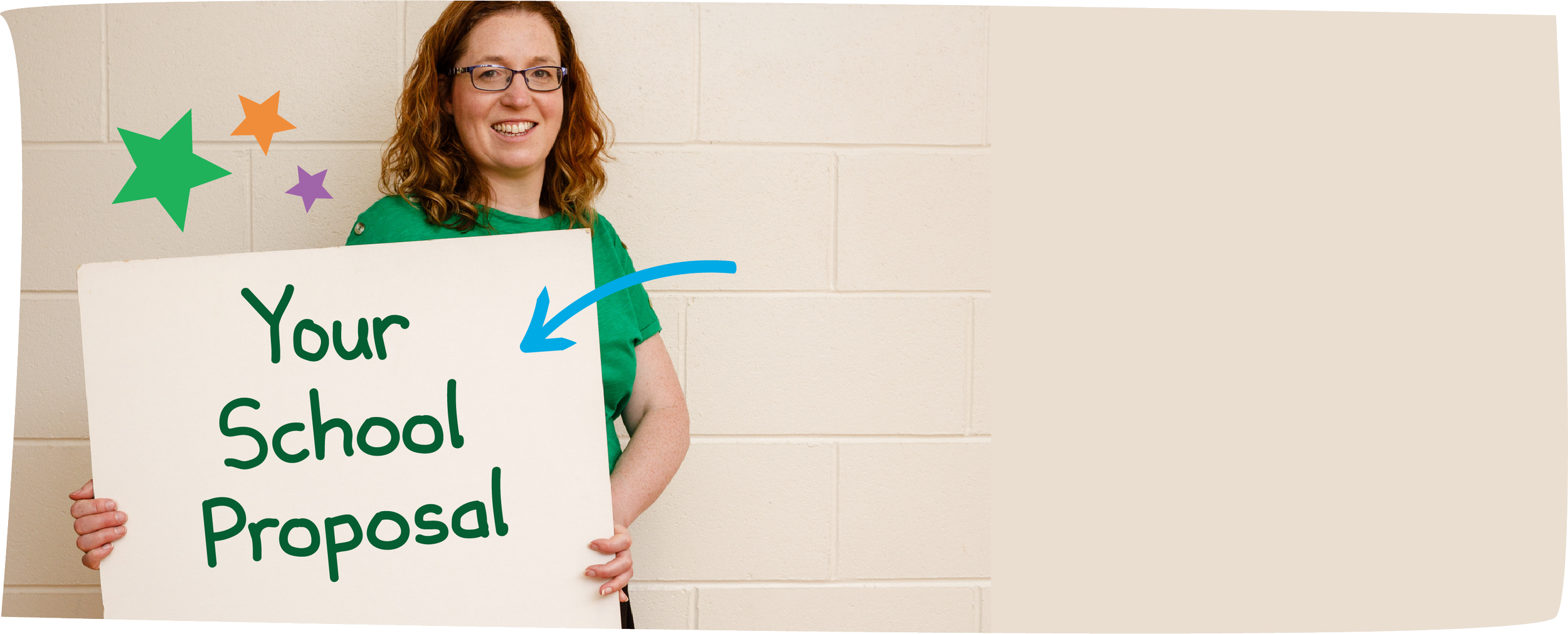 A woman with red hair and glasses holding a white sign that says 'Your School Proposal' in green letters, standing against a beige wall decorated with colorful stars.