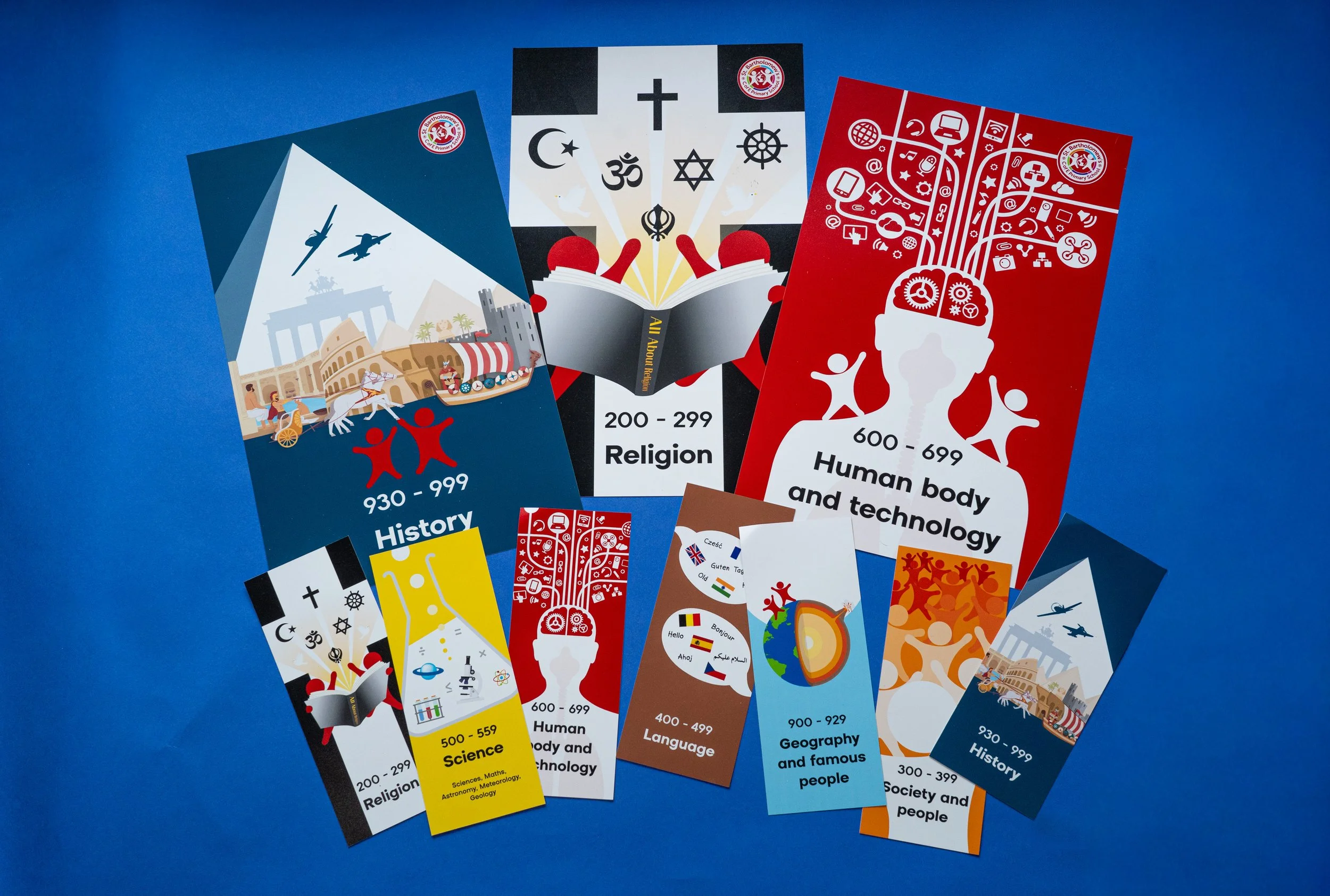 Collection of educational posters about subjects such as history, religion, science, language, geography, and technology, featuring various illustrations and symbols, with a blue background.