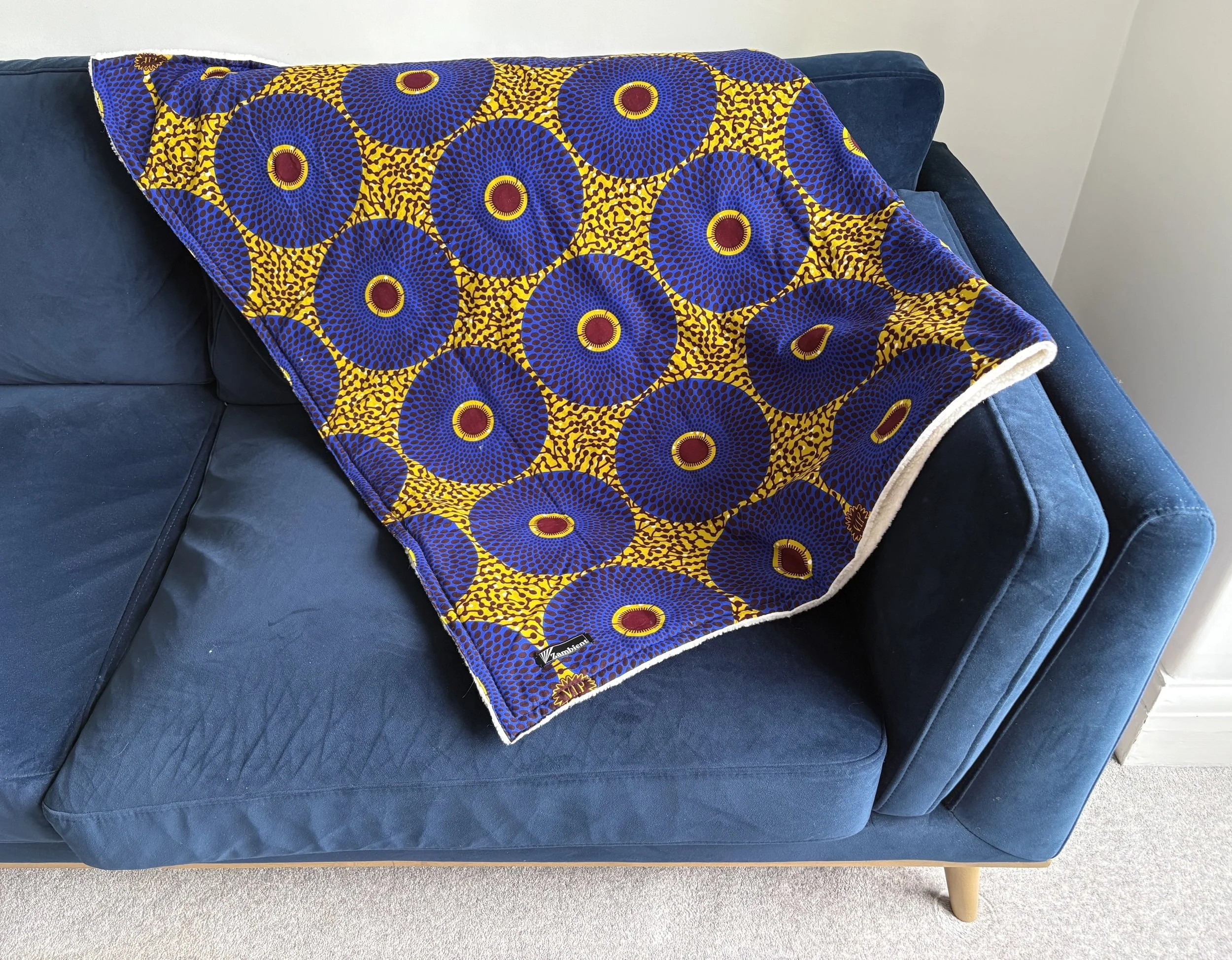 Blue Circles Fleece Blanket - Blue Sofa.jpg